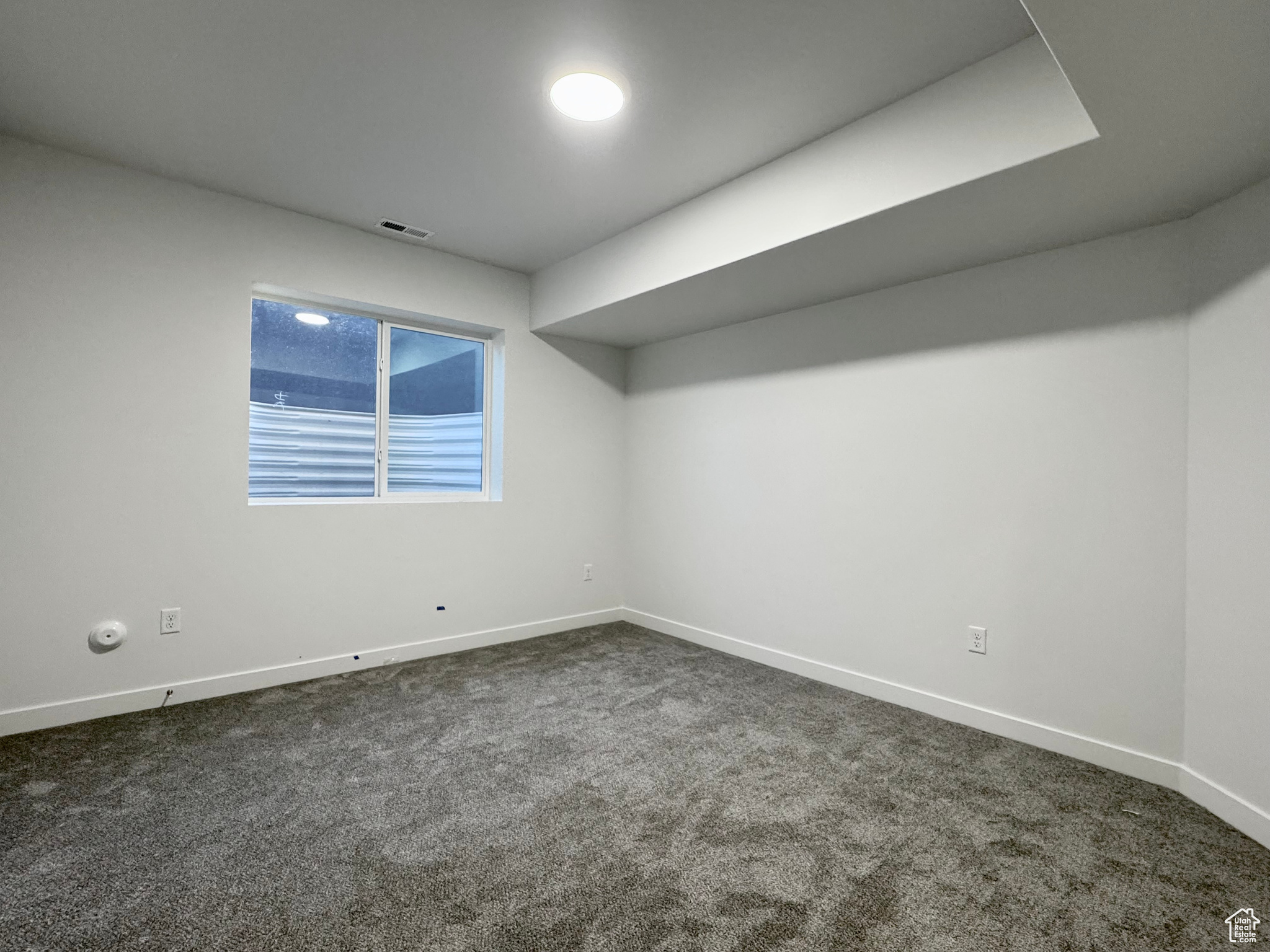 View of carpeted spare room