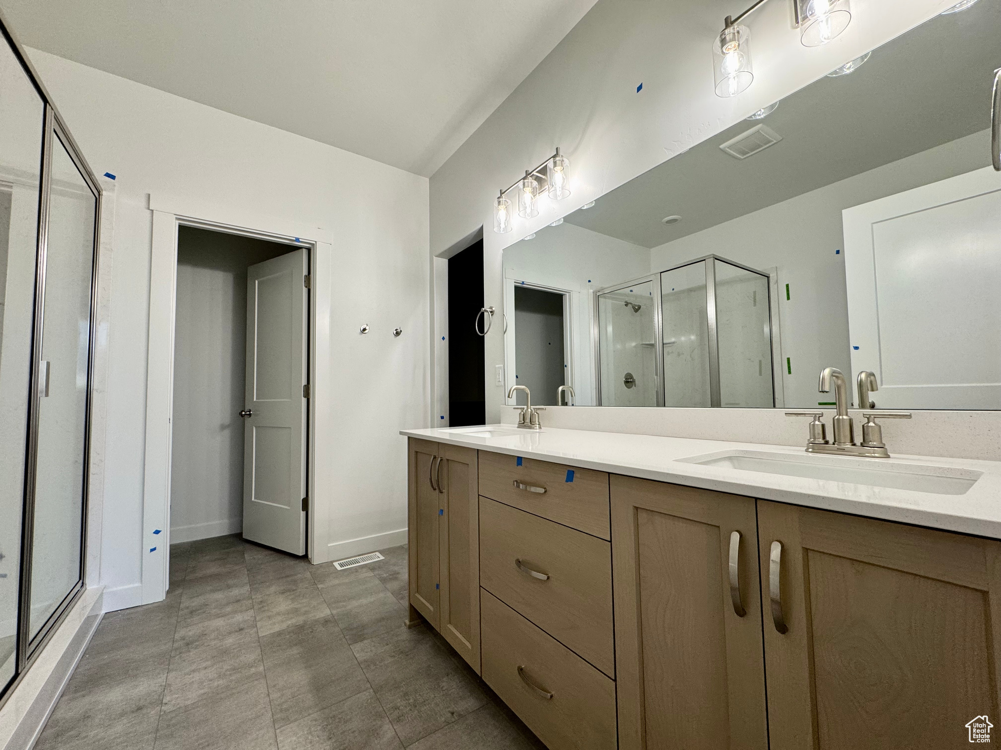 Bathroom with vanity and walk in shower