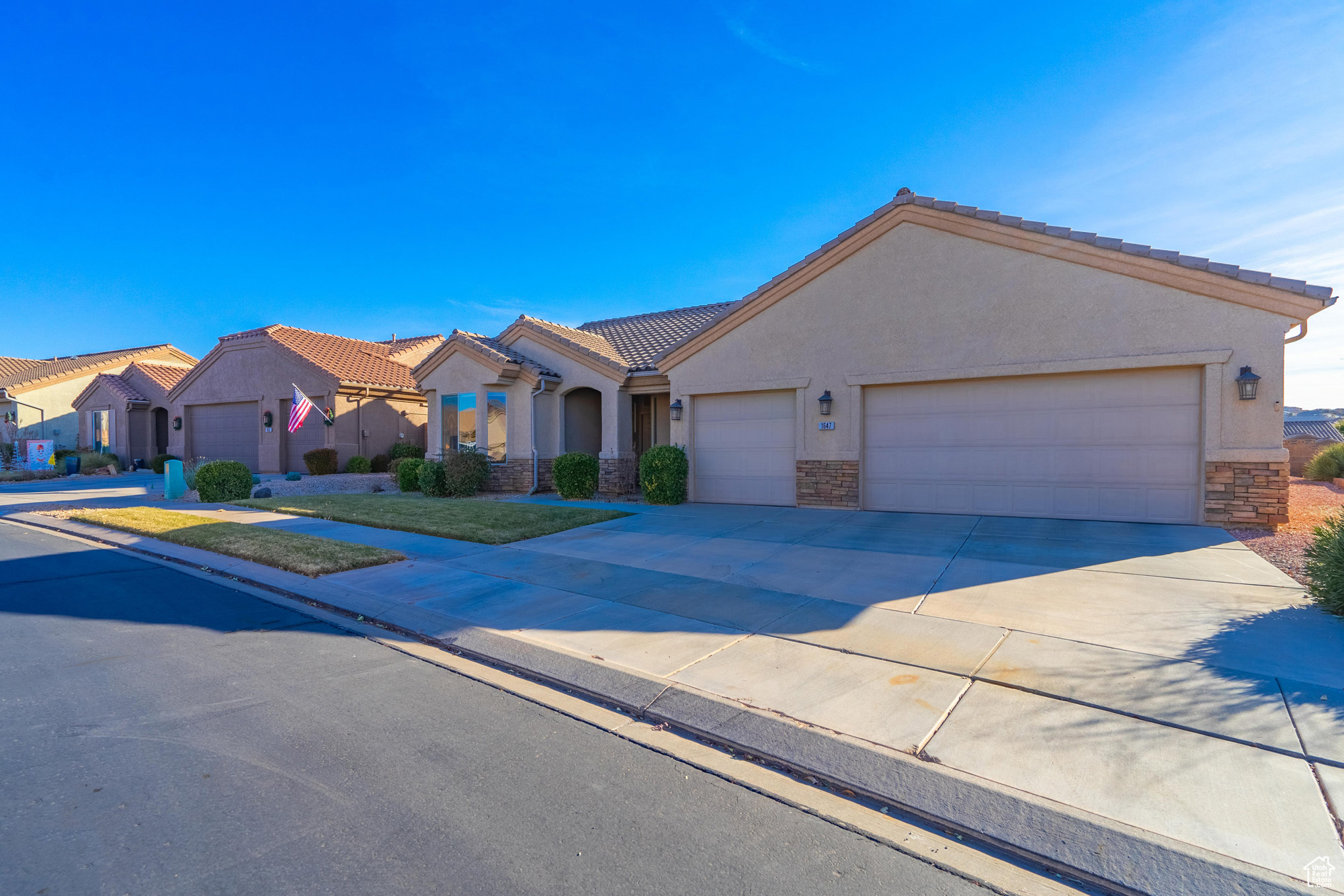 View of front of home with a 3 car garage