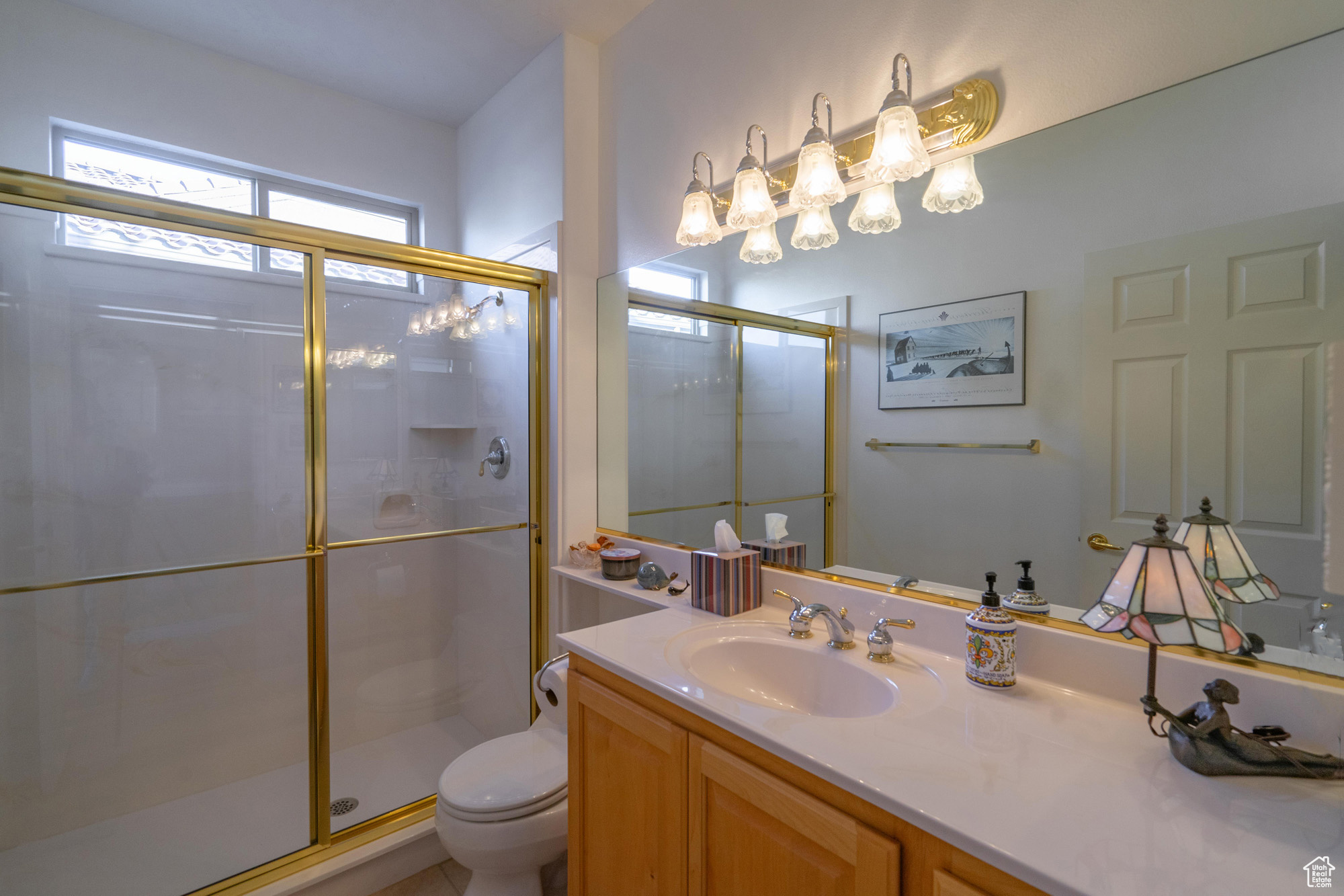 2nd Bathroom featuring vanity, toilet, and a walk-in shower with shower door