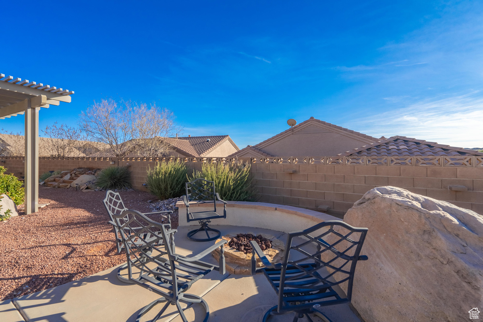 View of patio featuring a fire pit