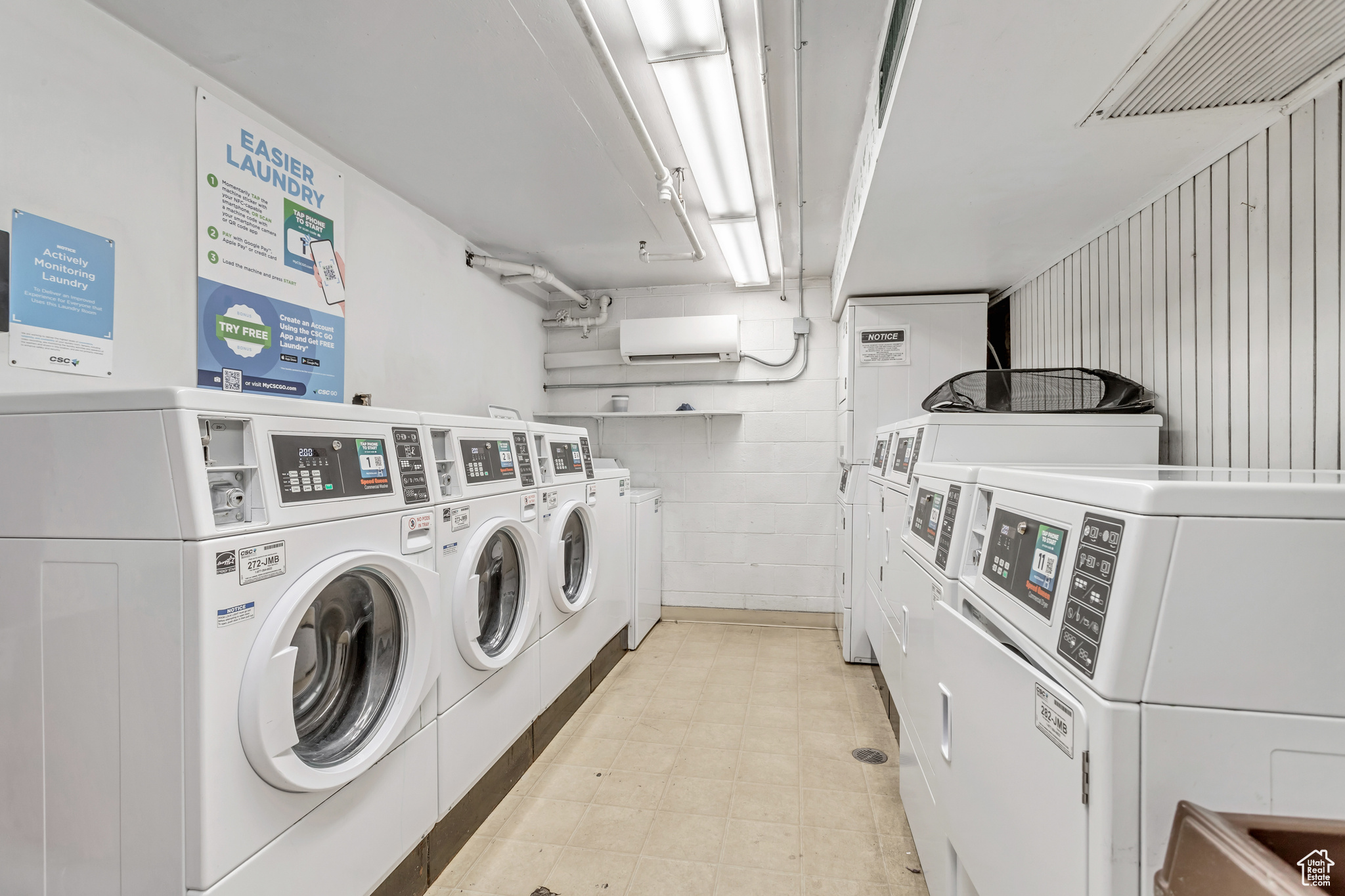 Laundry area with washing machine and clothes dryer