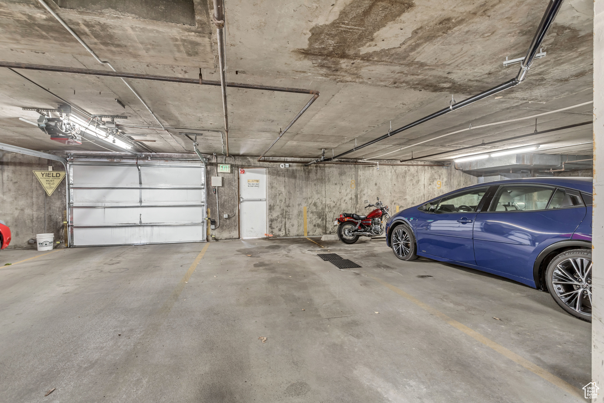 Garage featuring a garage door opener