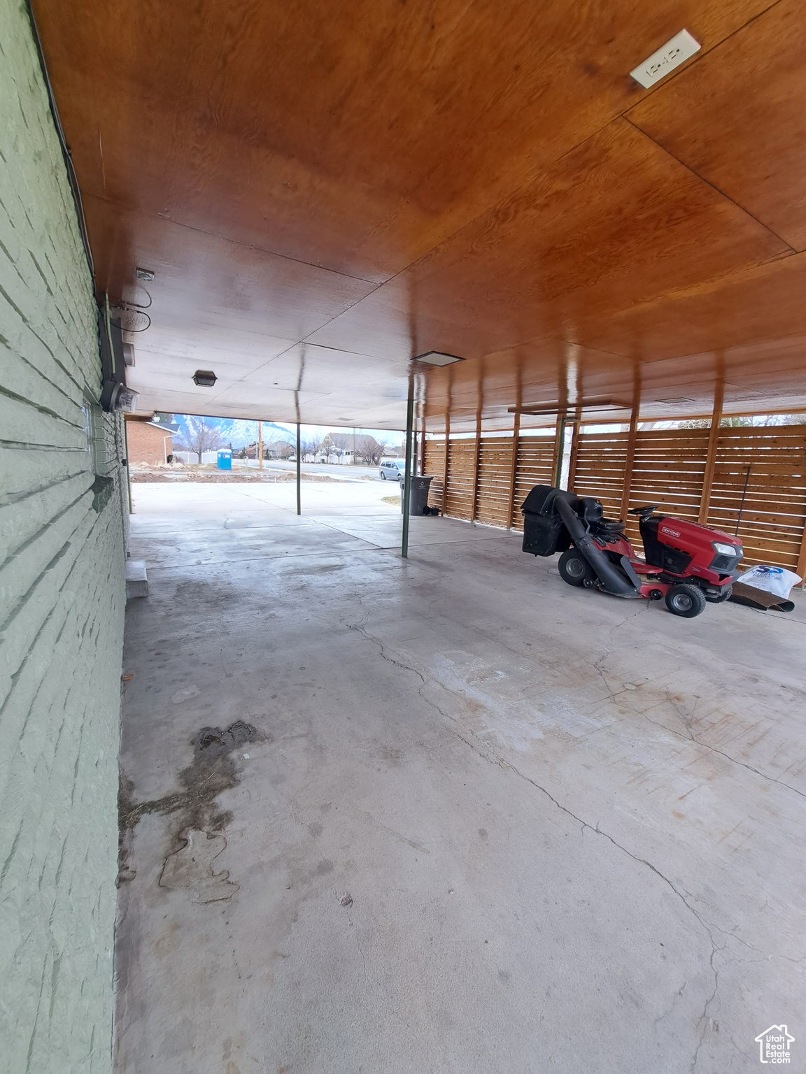 Garage featuring wooden ceiling