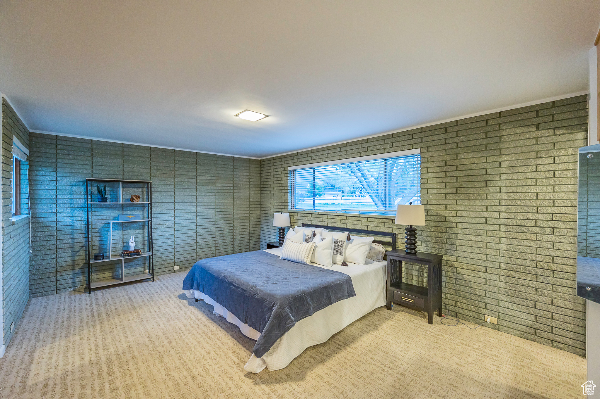 Bedroom with light carpet and ornamental molding