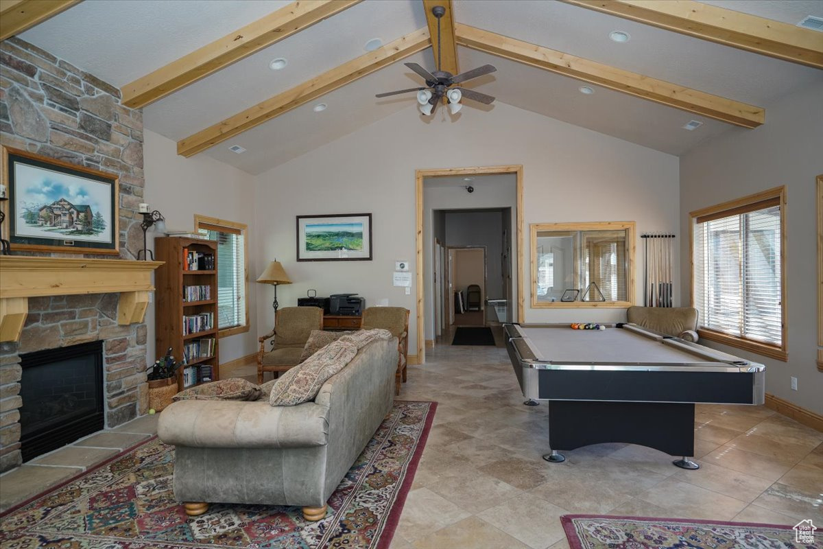 Club House Game room with high vaulted ceiling, ceiling fan, a fireplace, pool table, and beam ceiling