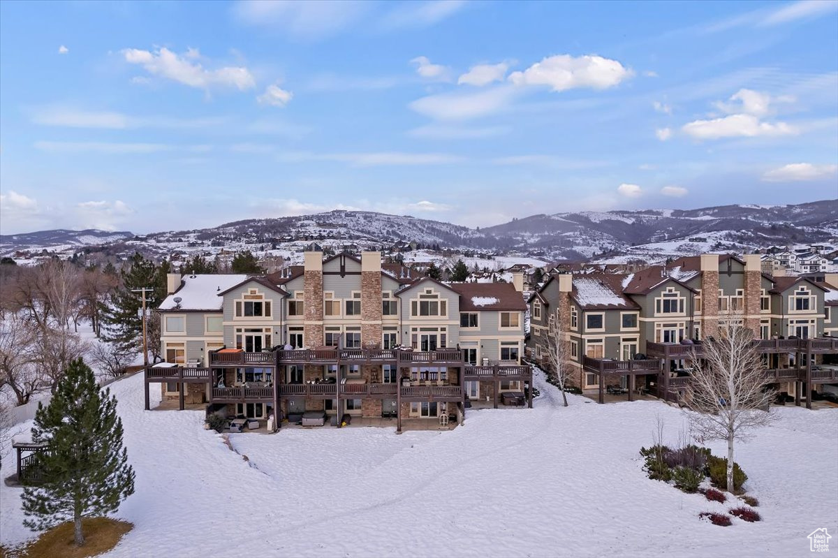 Snow covered building featuring a mountain view