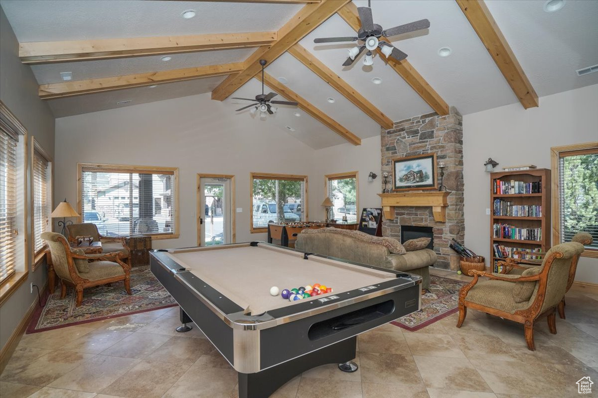 Club House Rec room featuring high vaulted ceiling, plenty of natural light, a fireplace, and billiards