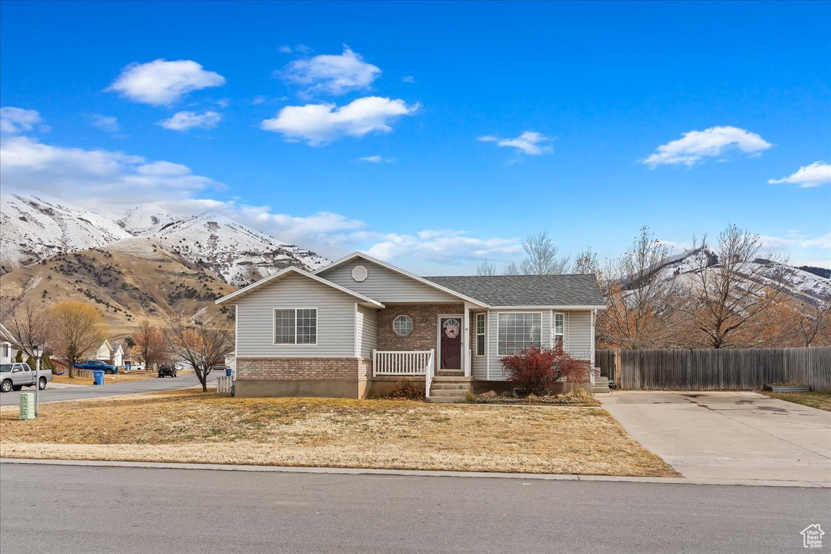 Single story home featuring a mountain view