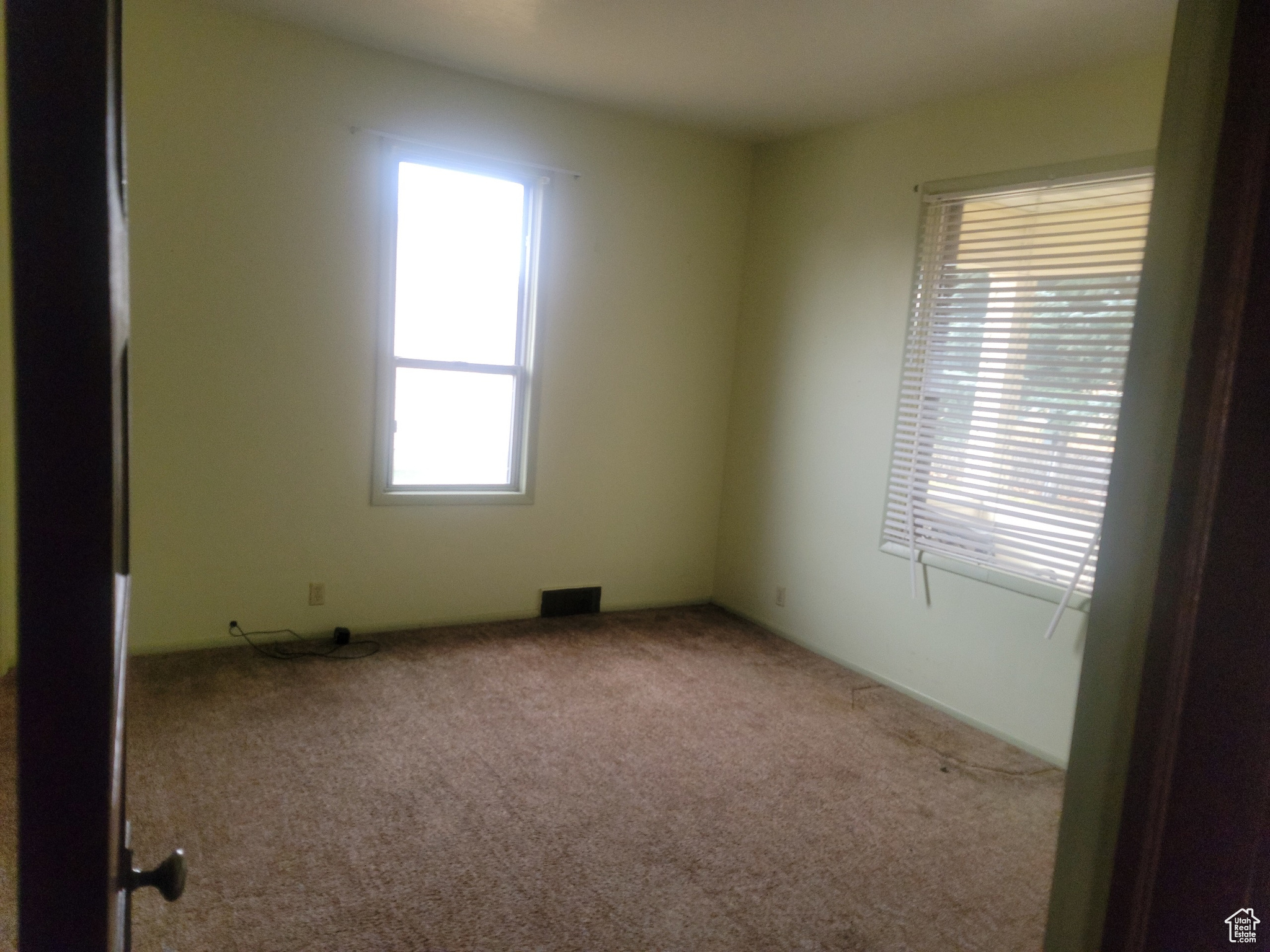 Spare room featuring carpet