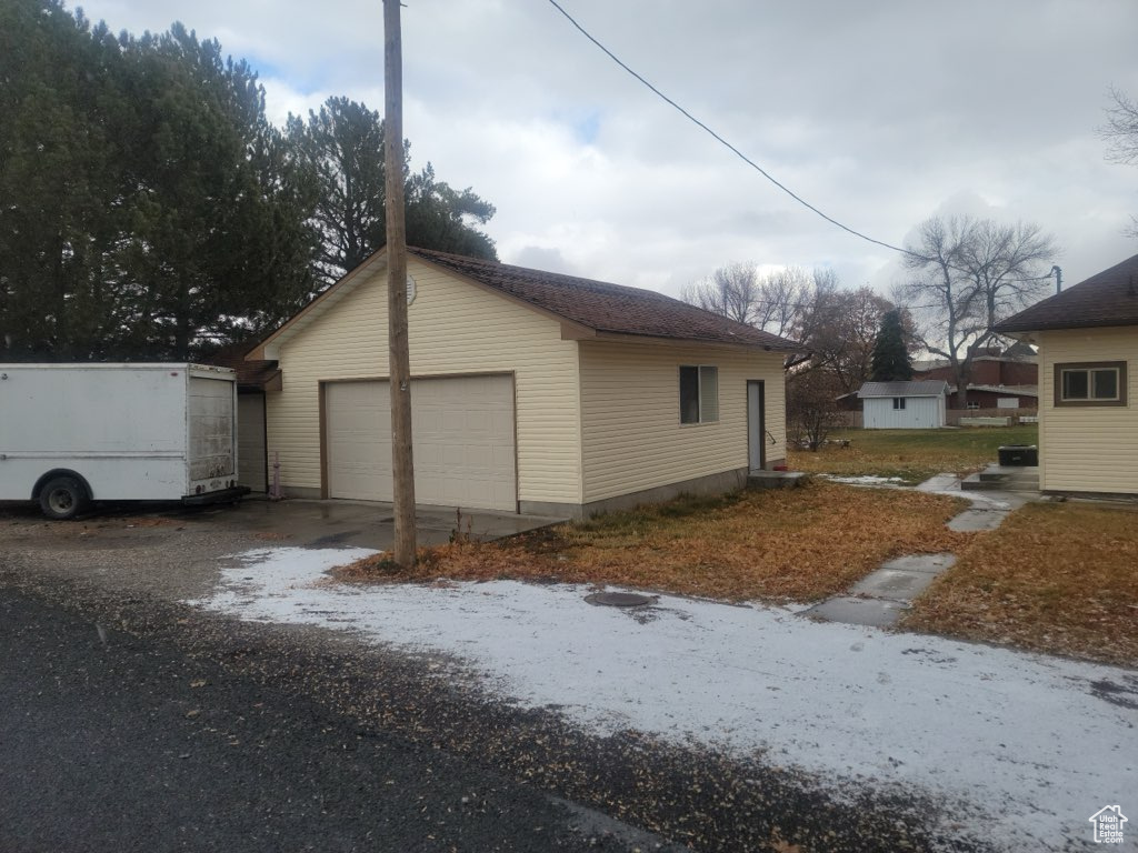 View of home's exterior with garage