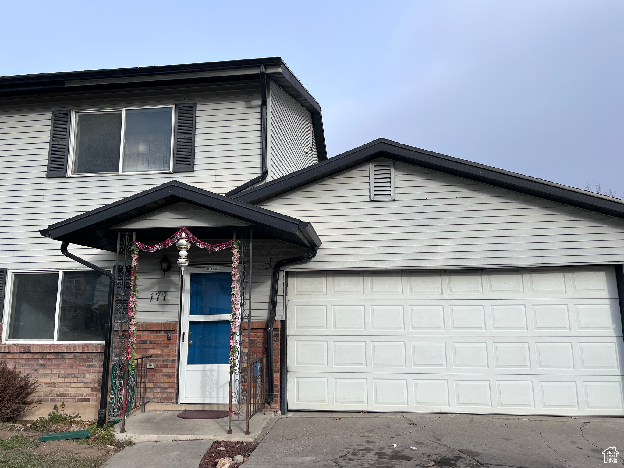 View of front facade featuring a garage