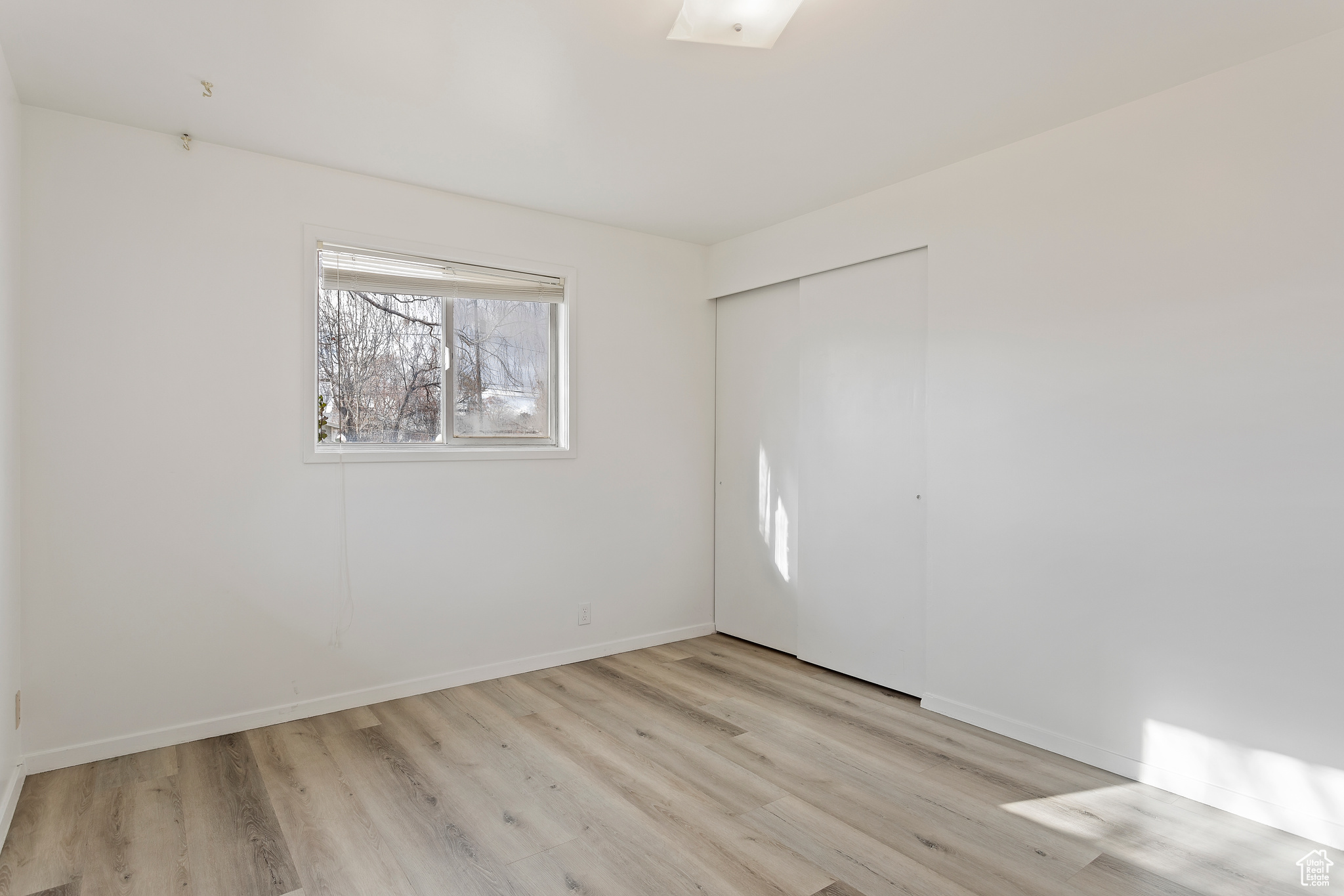 Spare room with light hardwood / wood-style floors