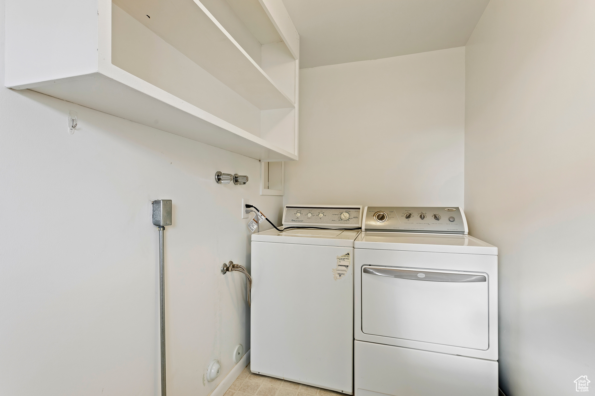 Laundry room featuring separate washer and dryer