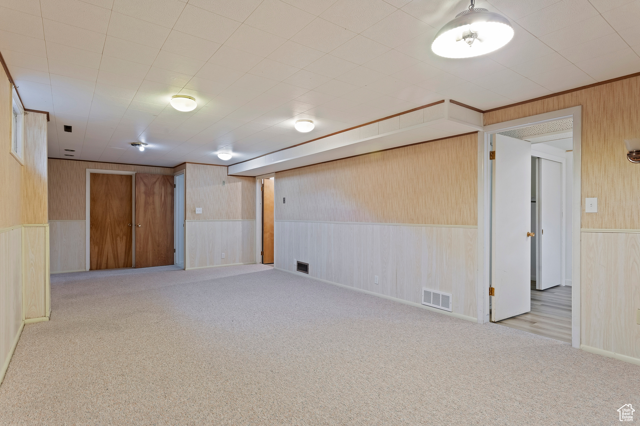 Basement with light carpet