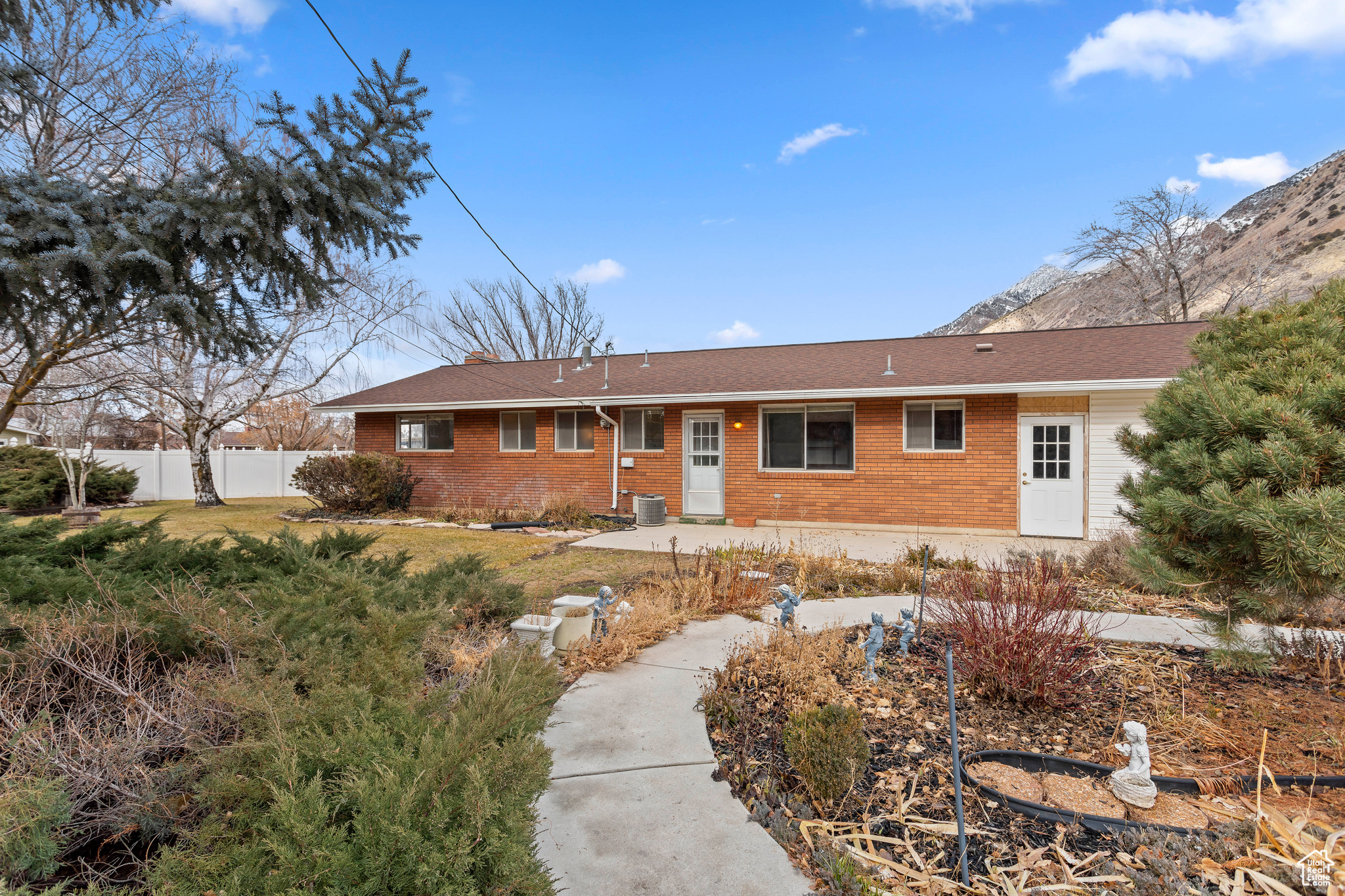 Single story home featuring cooling unit