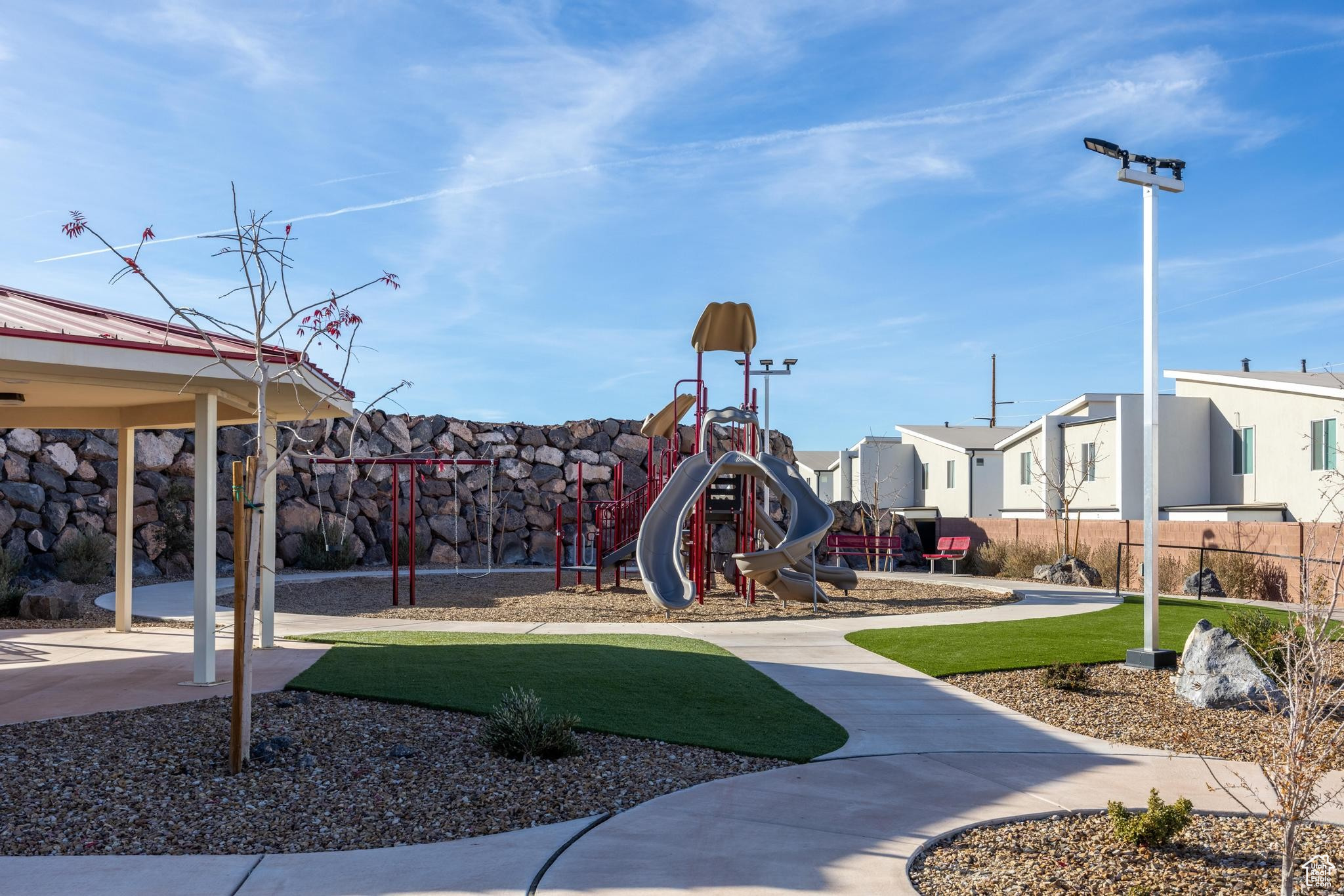 View of play area featuring a lawn