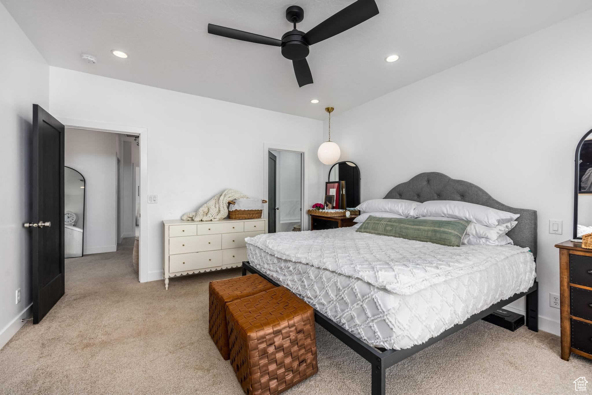 Master bedroom with ceiling fan, pendent and recessed lighting