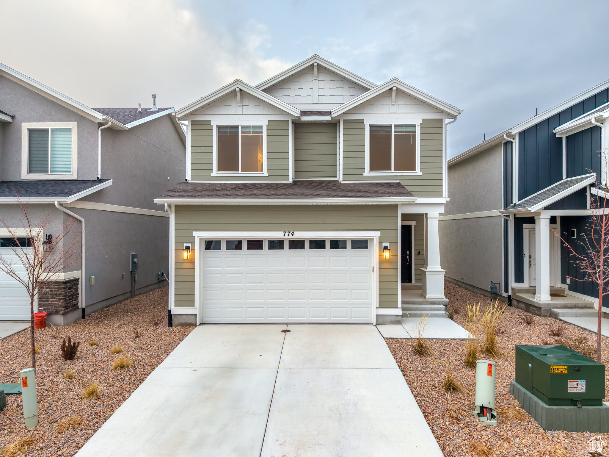 View of front of property featuring a garage