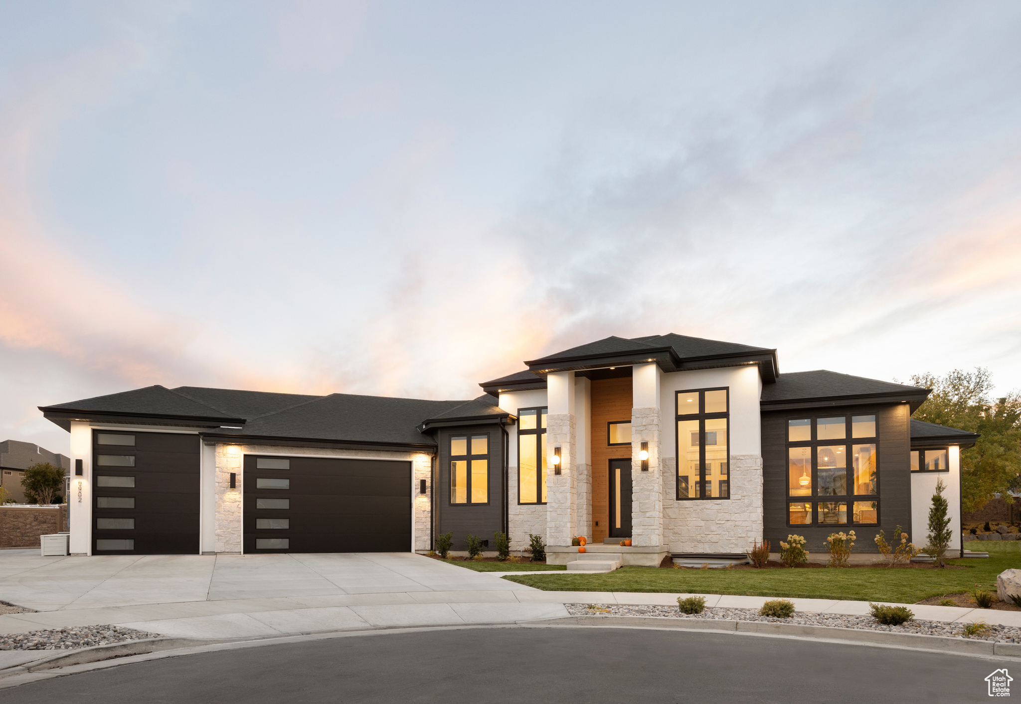 Prairie-style home featuring a garage