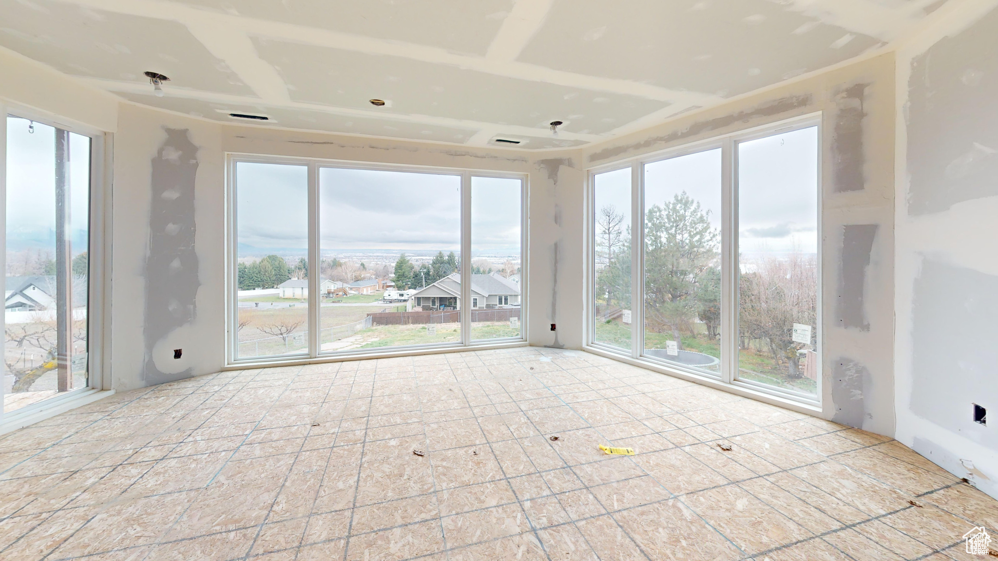 Unfurnished sunroom featuring a wealth of natural light