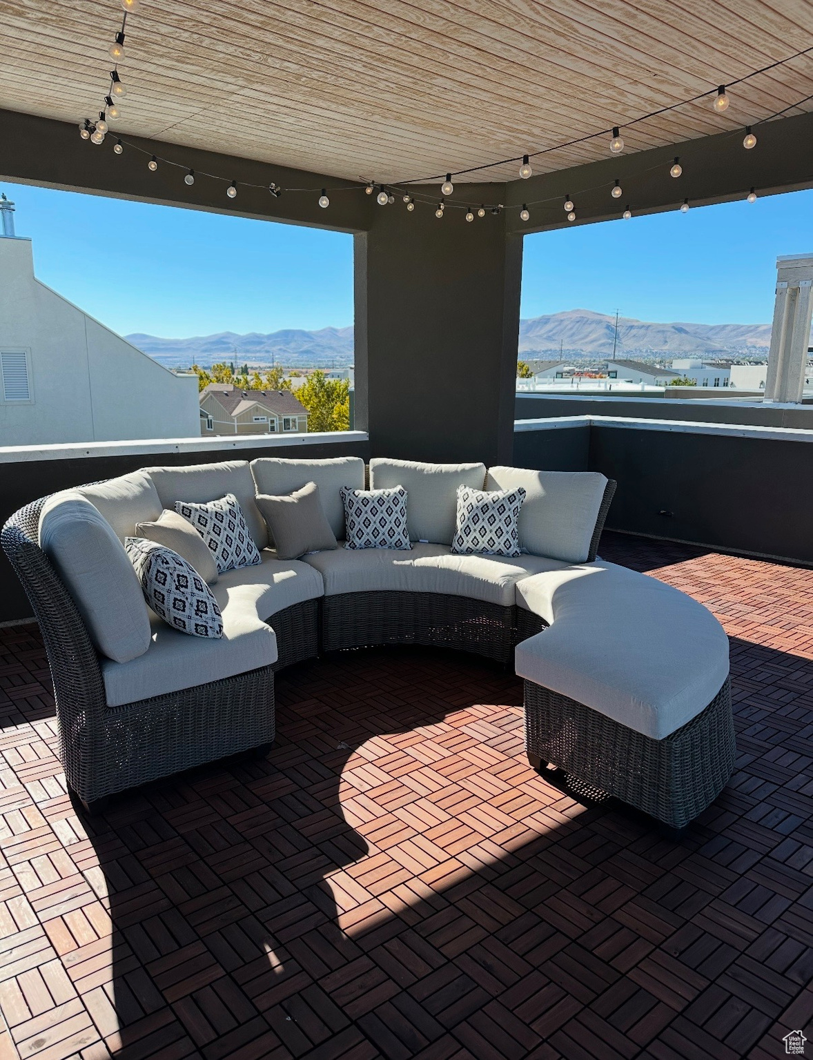 View of patio with outdoor lounge area and a mountain view and new flooring