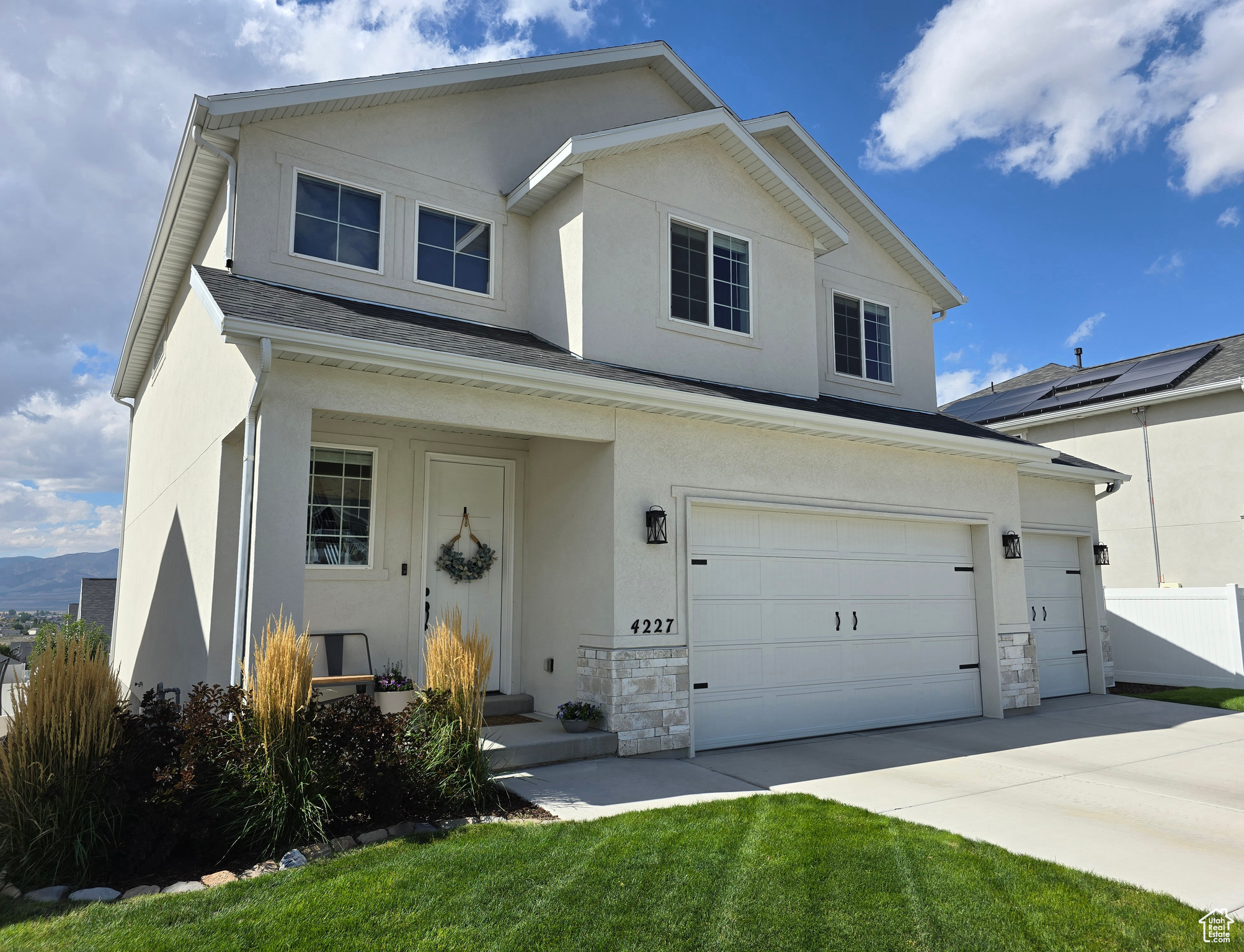 View of front of property featuring a garage