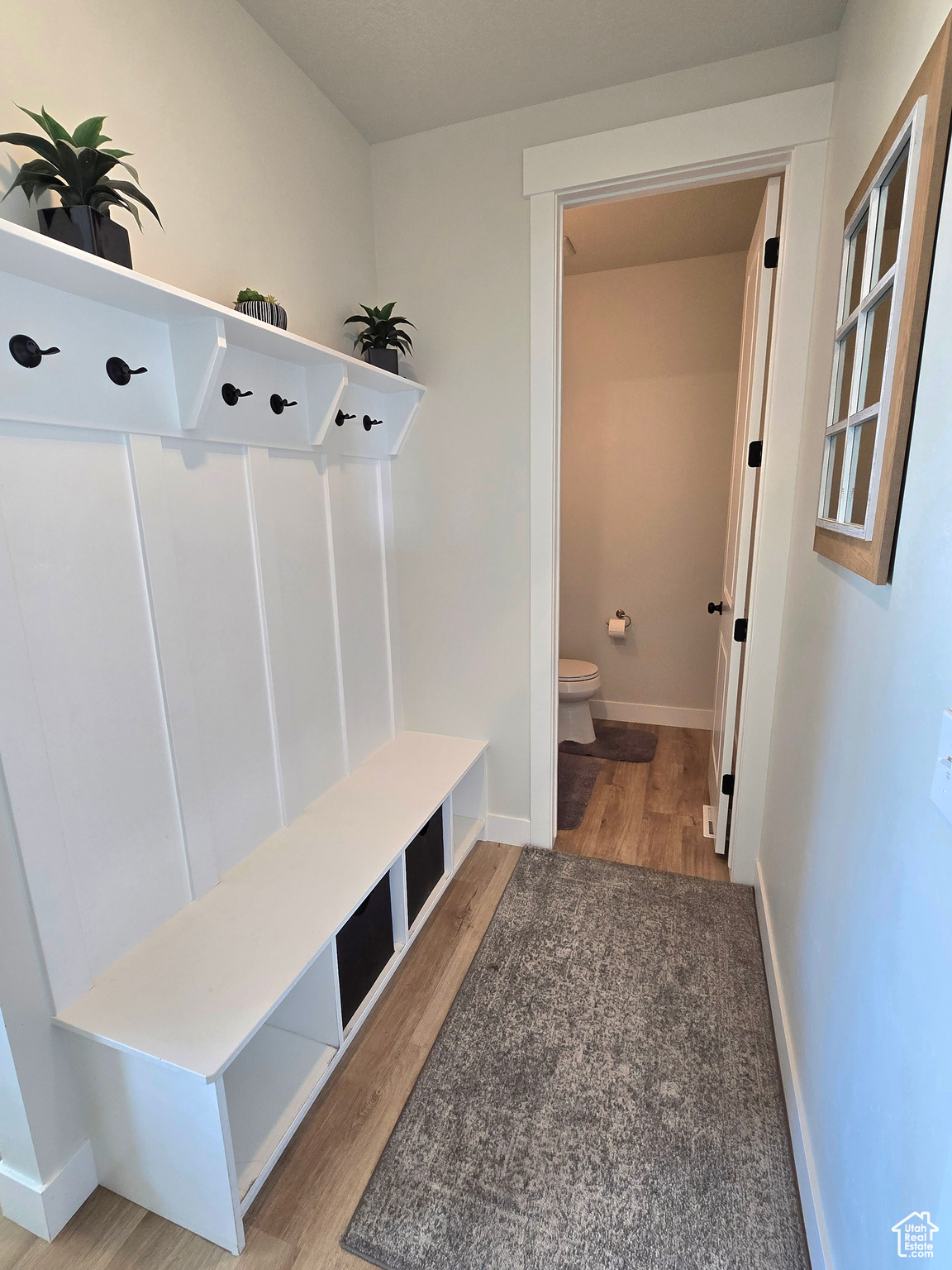 Mudroom with light wood-type flooring