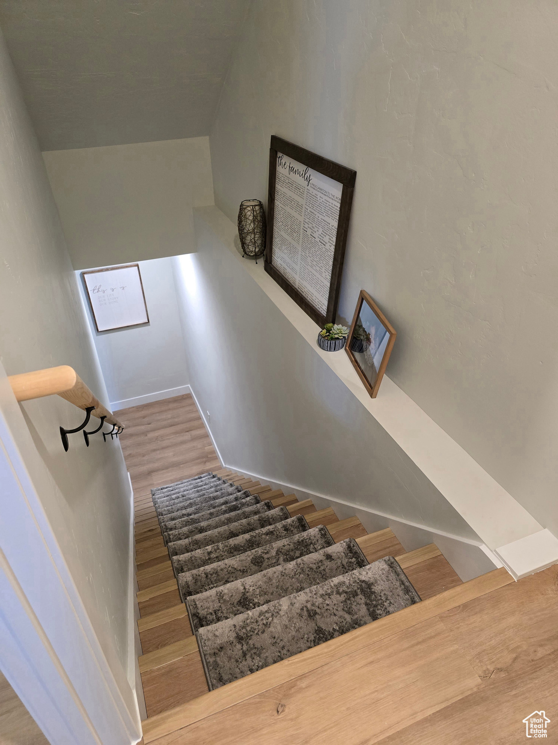 Stairway with hardwood / wood-style floors