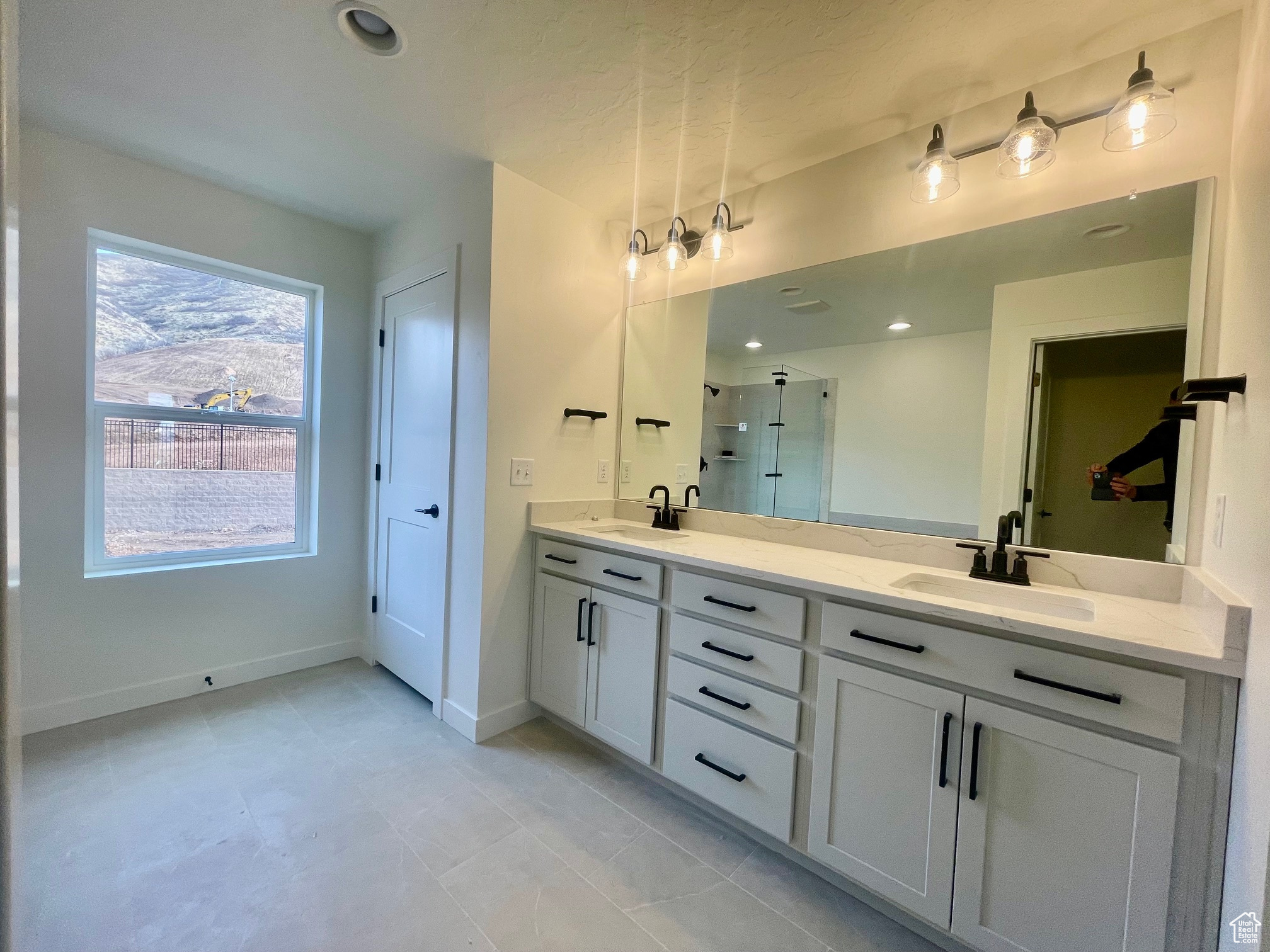 Primary Bathroom featuring vanity and an enclosed shower