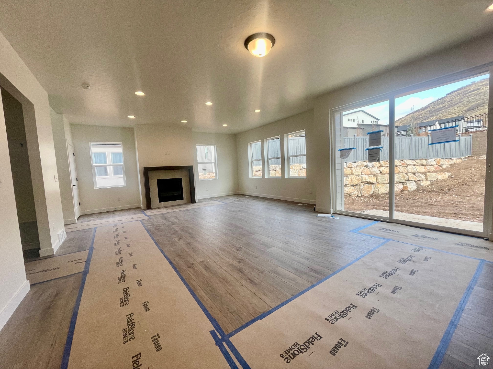 Unfurnished living room with hardwood / wood-style flooring