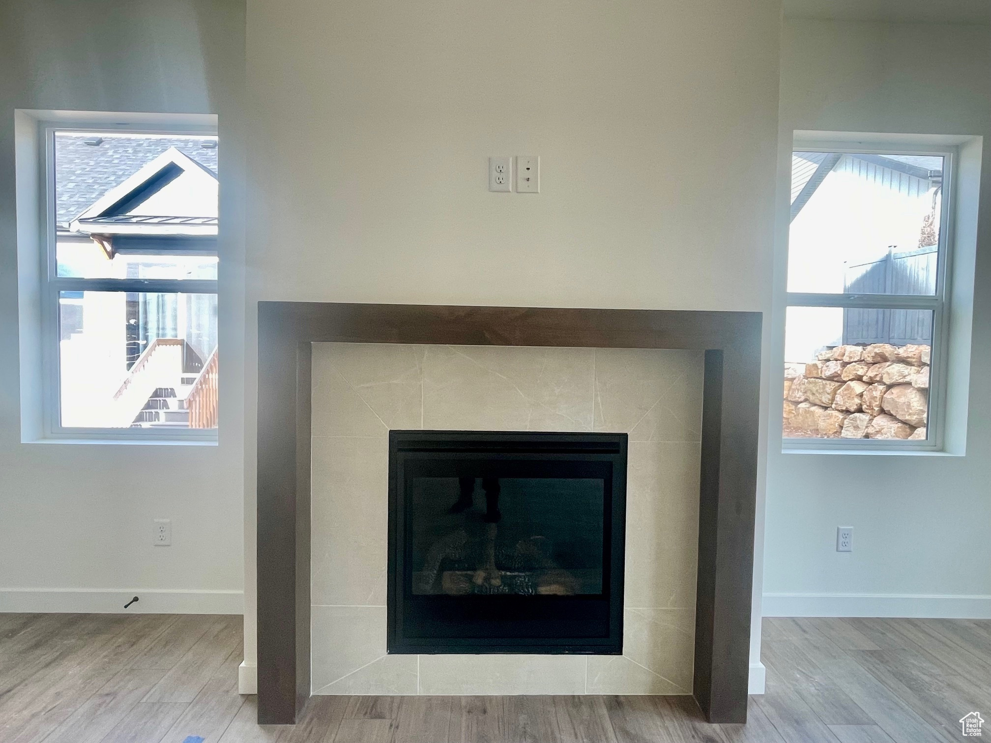 Interior details with hardwood / wood-style flooring and a fireplace