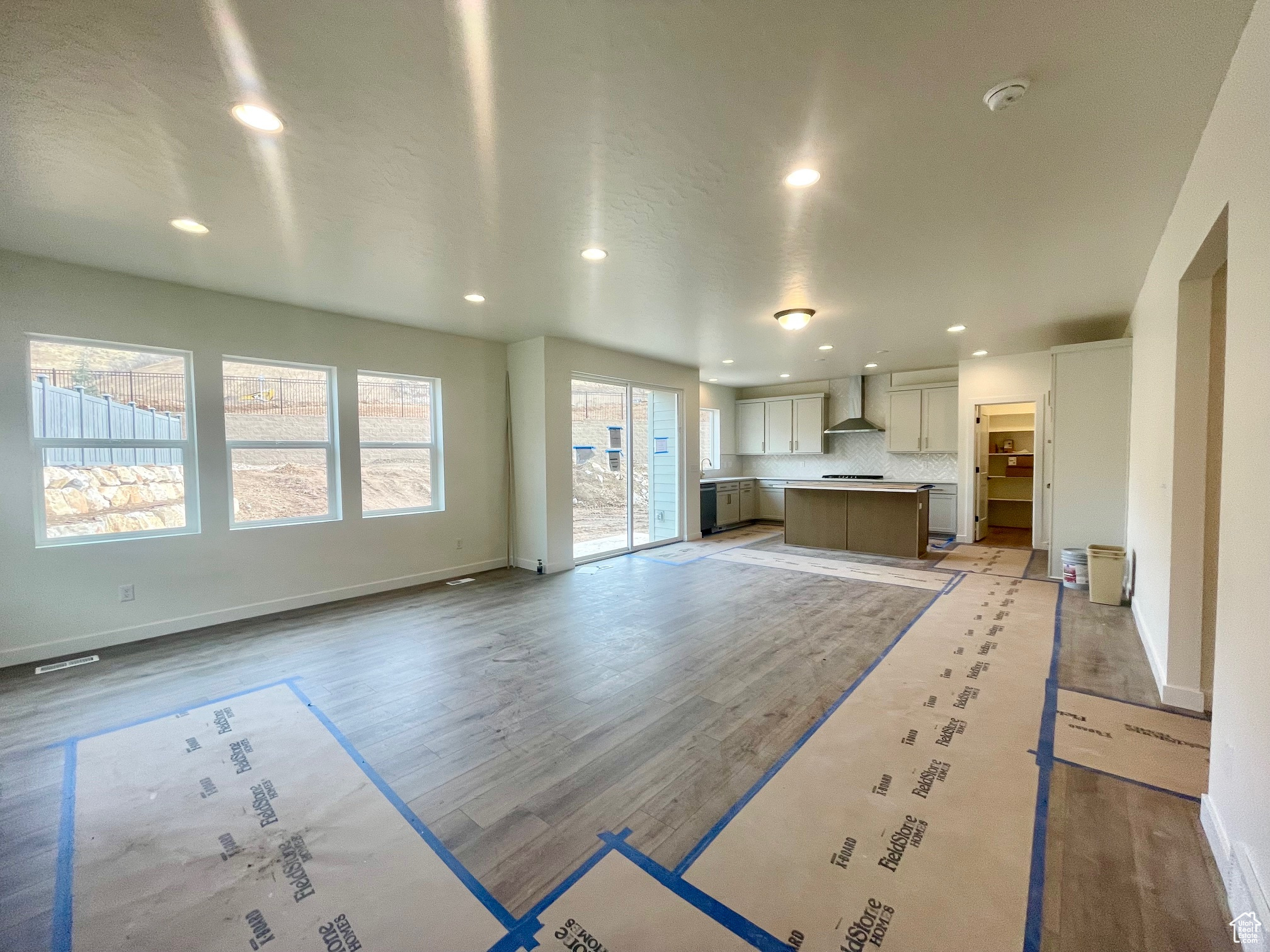 Unfurnished living room featuring light wood-type flooring