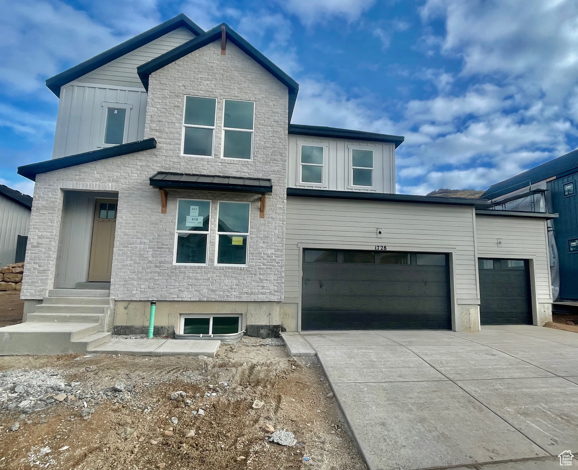 View of front of property with a garage