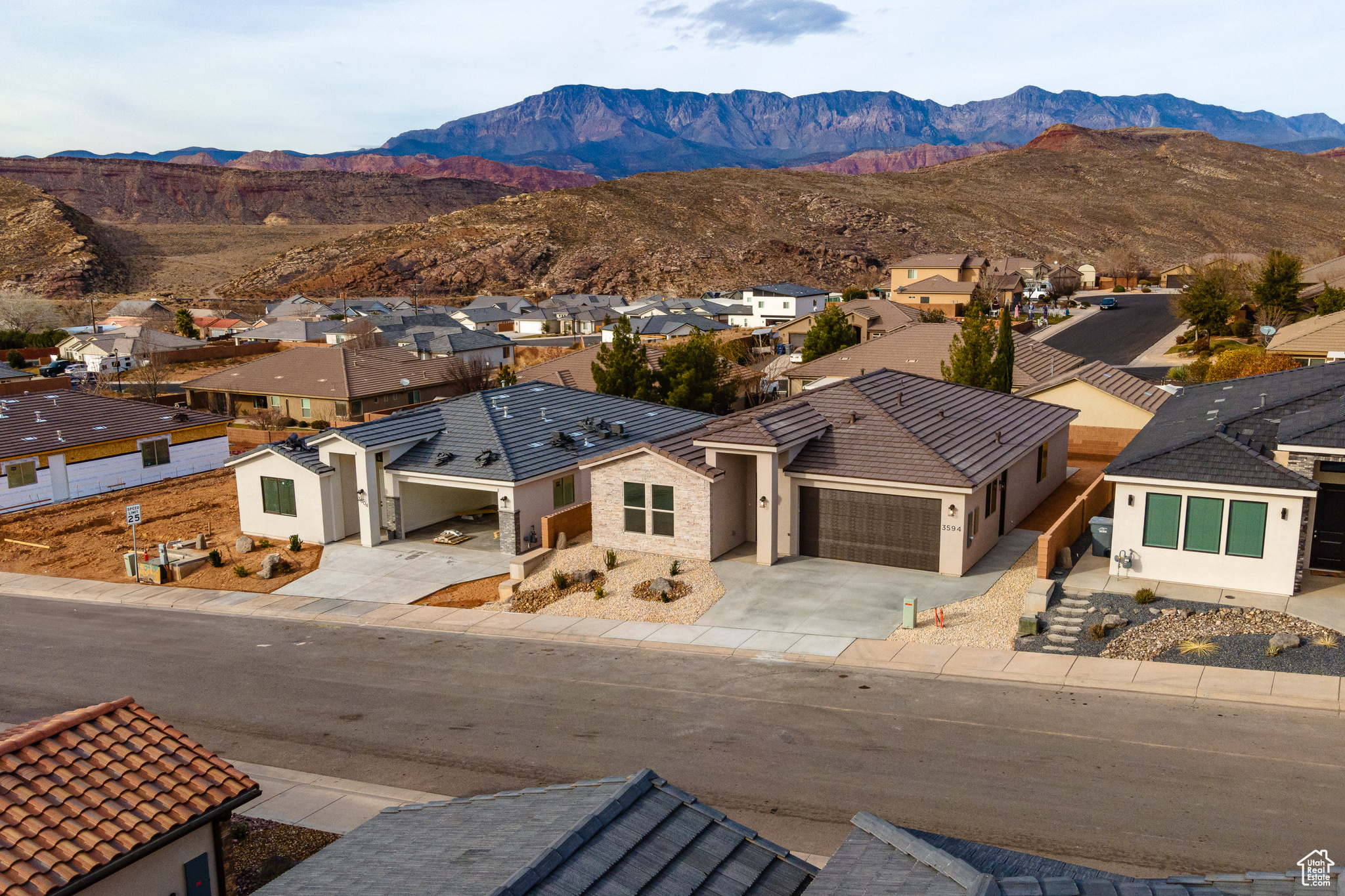 Birds eye view of property with a mountain view