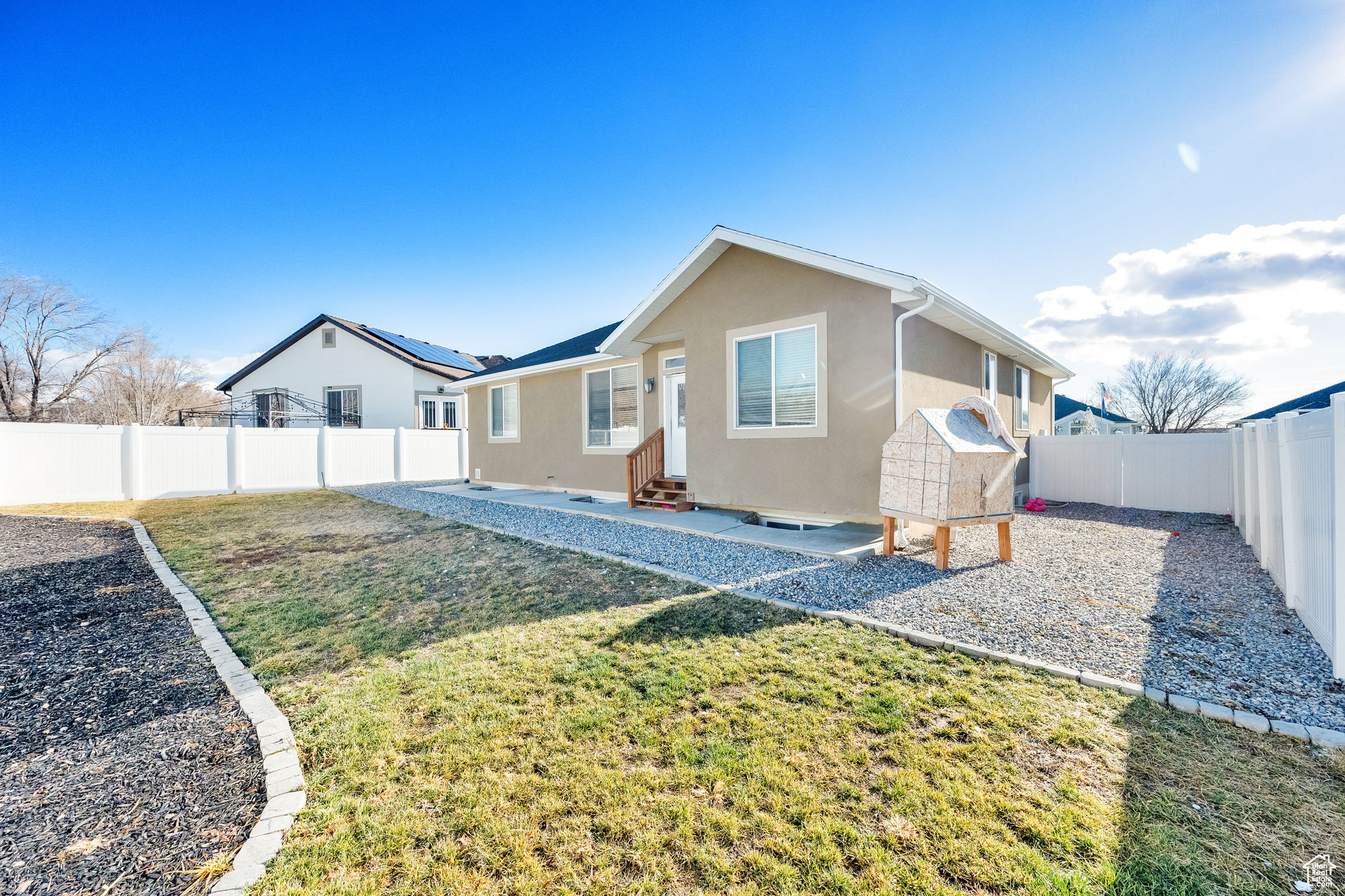 Rear view of property featuring a lawn