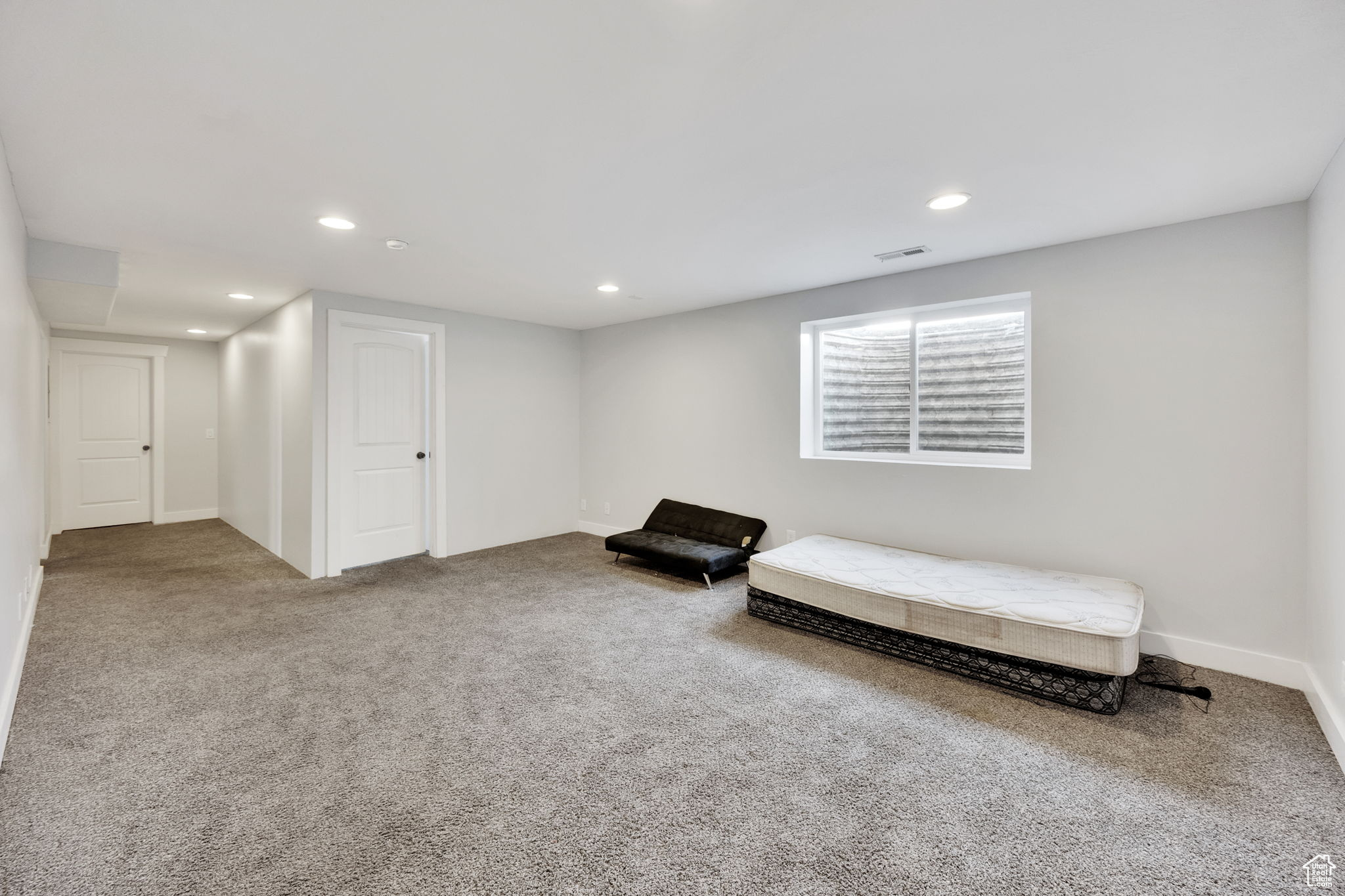 Living area featuring carpet flooring