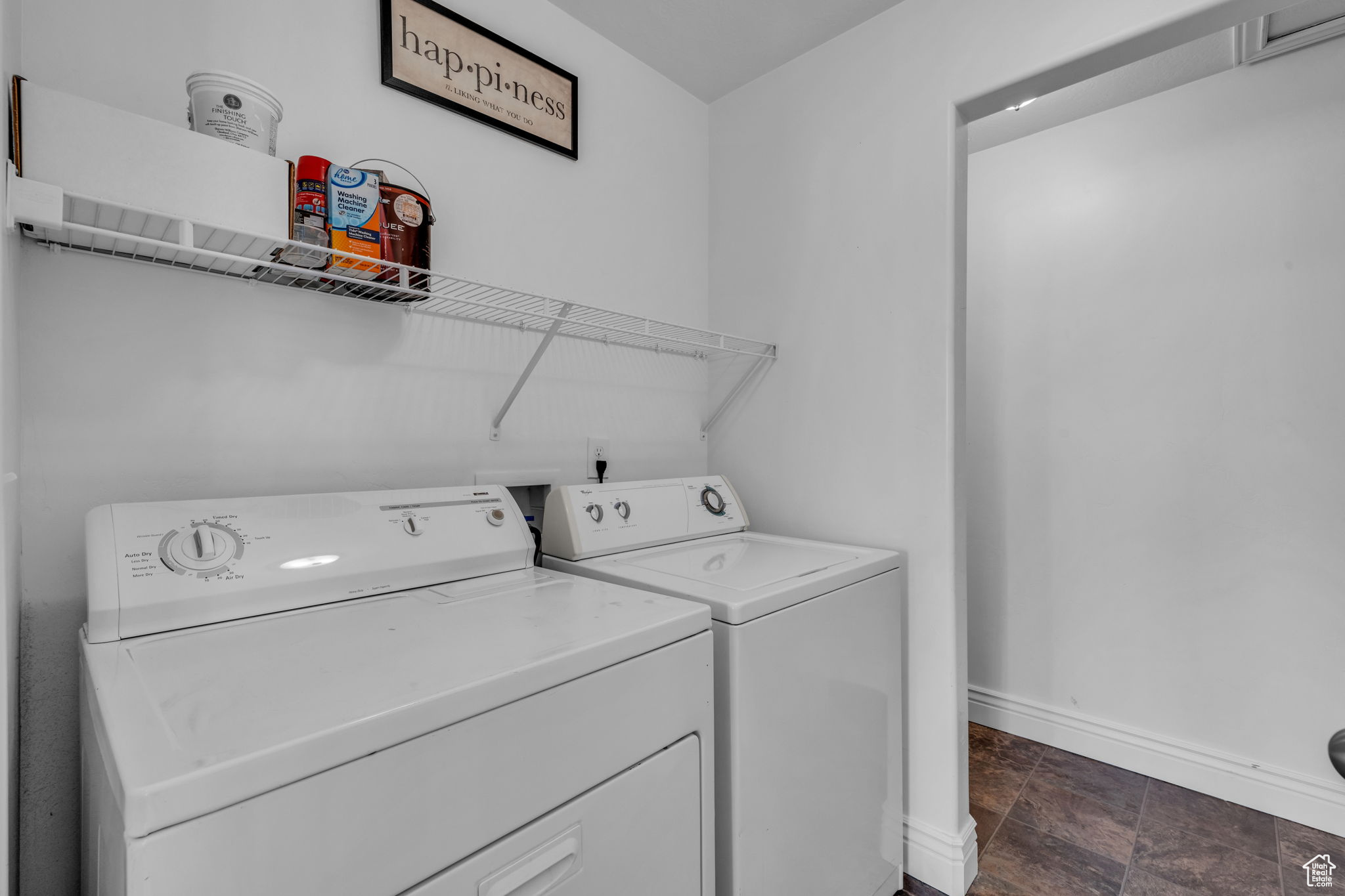 Laundry area with washing machine and clothes dryer and additional storage