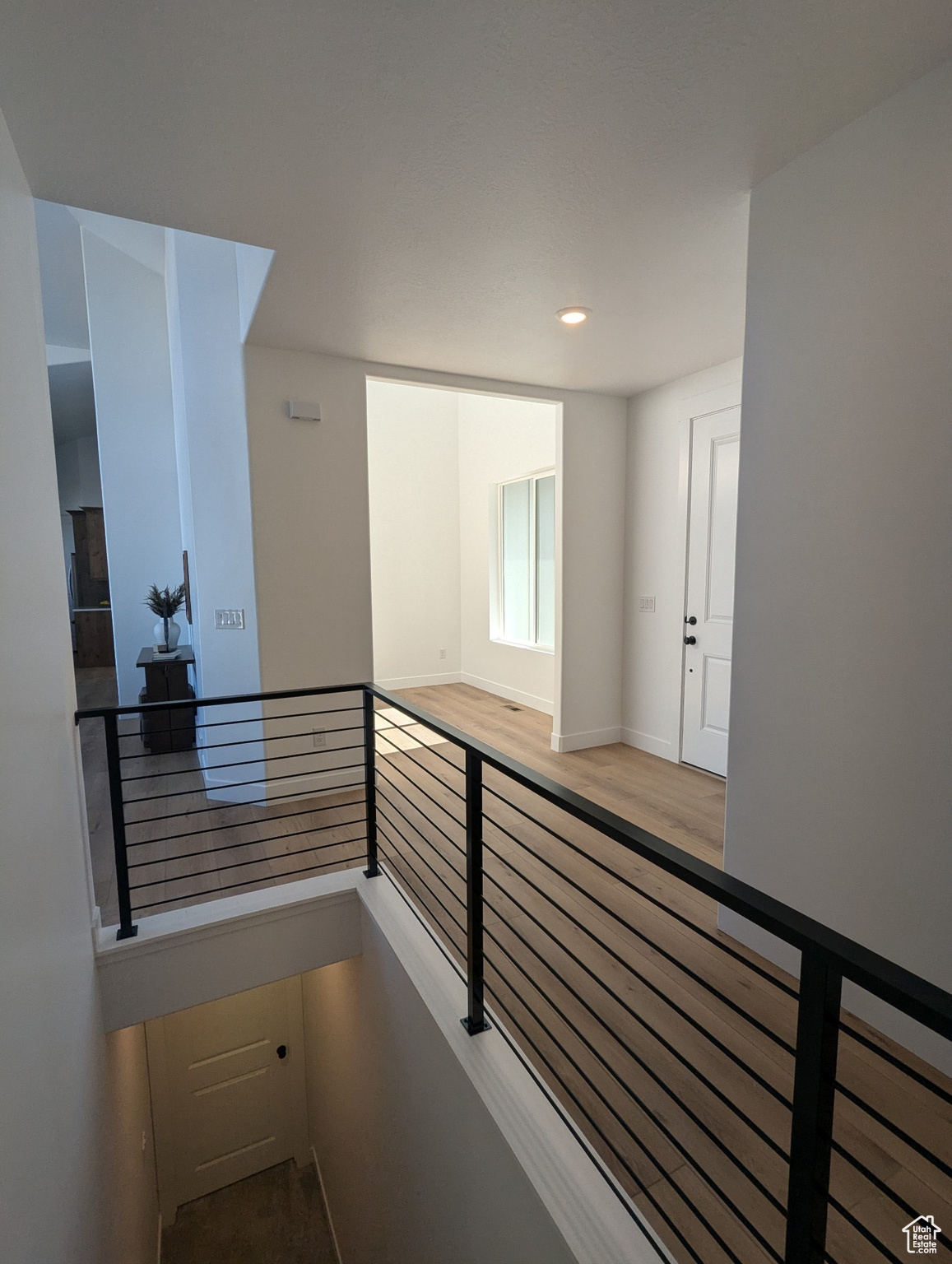 Corridor featuring hardwood / wood-style floors