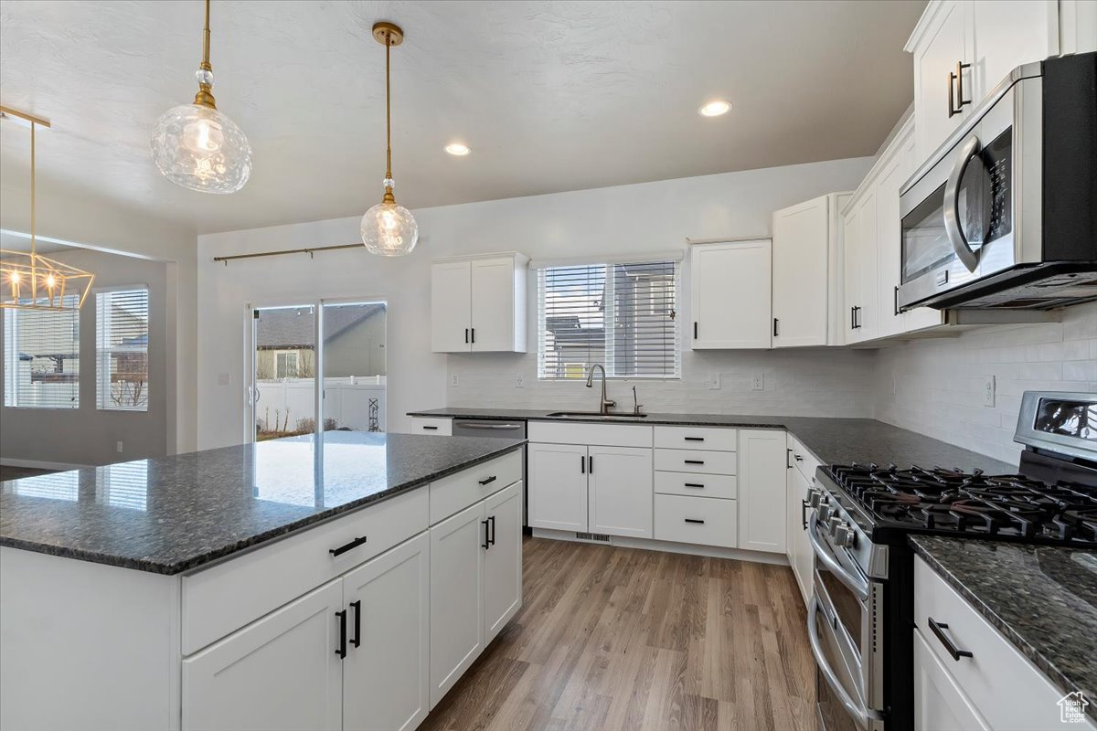 Spacious Kitchen featuring Granite Countertops and a large island, perfect for dining, gathering, and hosting guests.