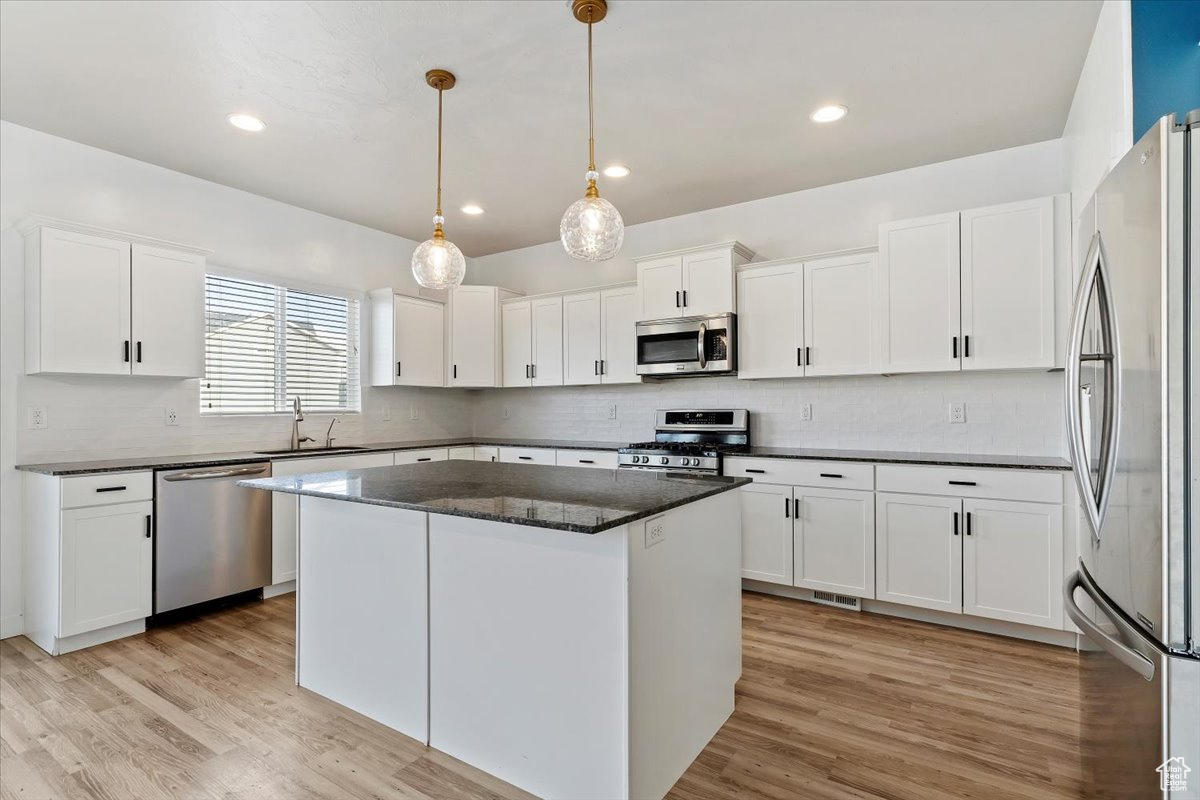 Spacious Kitchen featuring Granite Countertops and a large island, perfect for dining, gathering, and hosting guests.