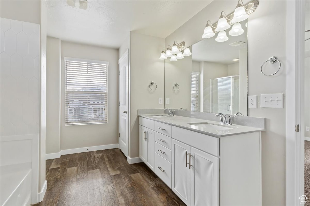 Spacious Ensuite Bathroom with a double vanity, a soaking tub and an enclosed shower