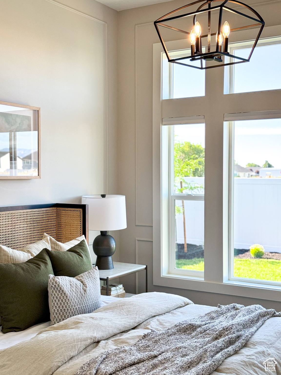 Bedroom with an inviting chandelier