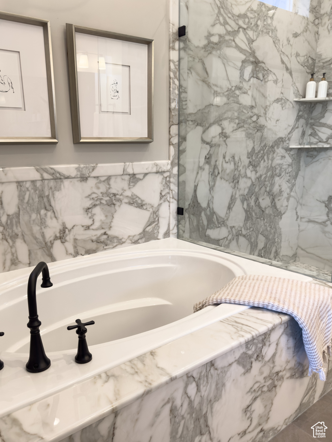 Bathroom featuring tiled bath