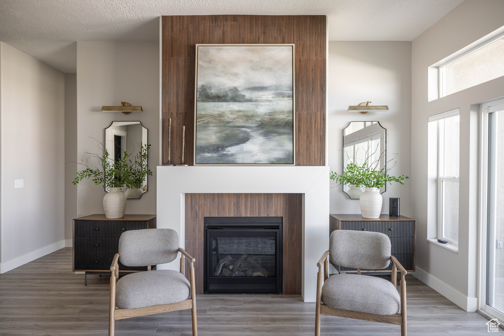 Living area featuring plenty of natural light and hardwood / wood-style flooring