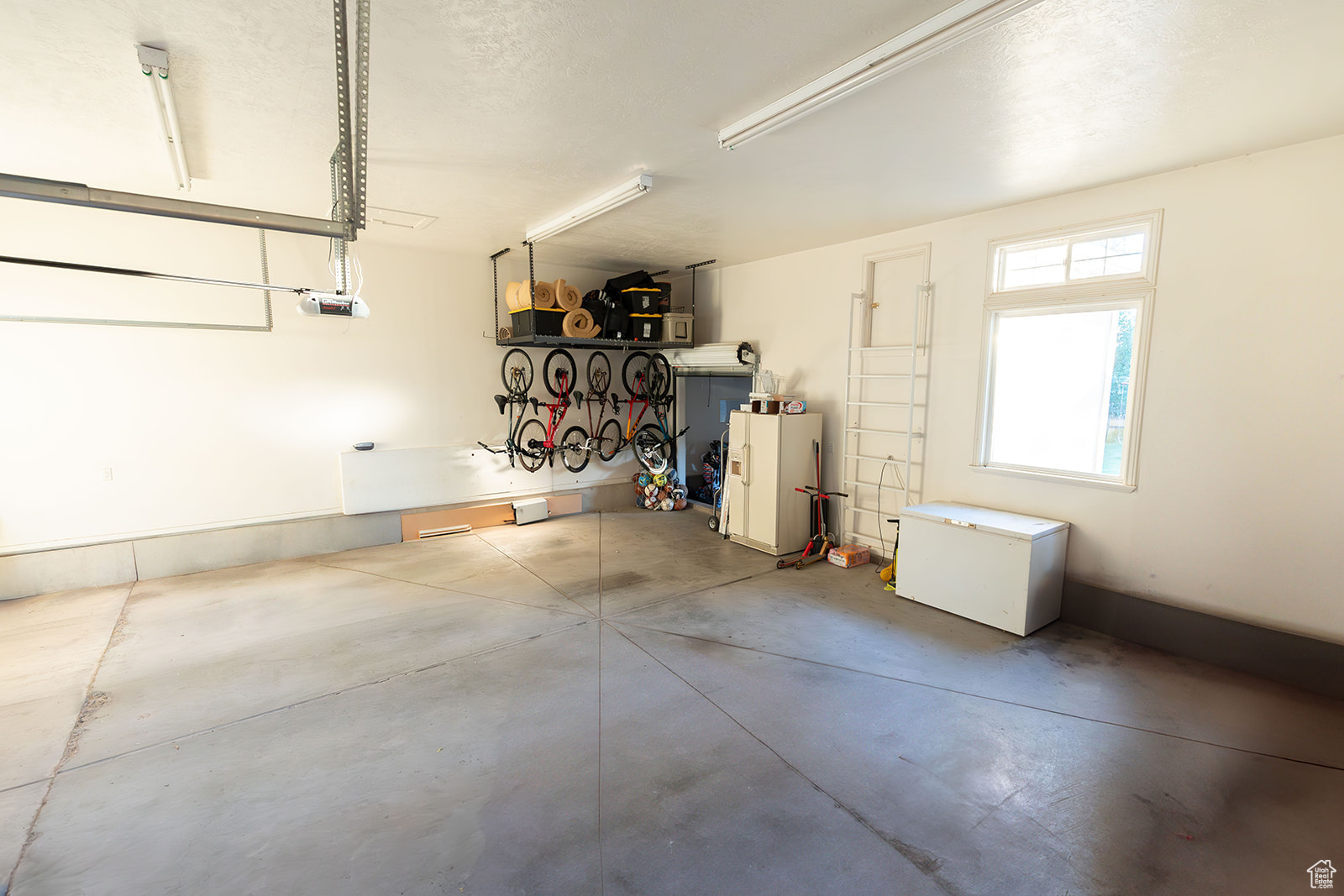 Garage featuring a garage door opener