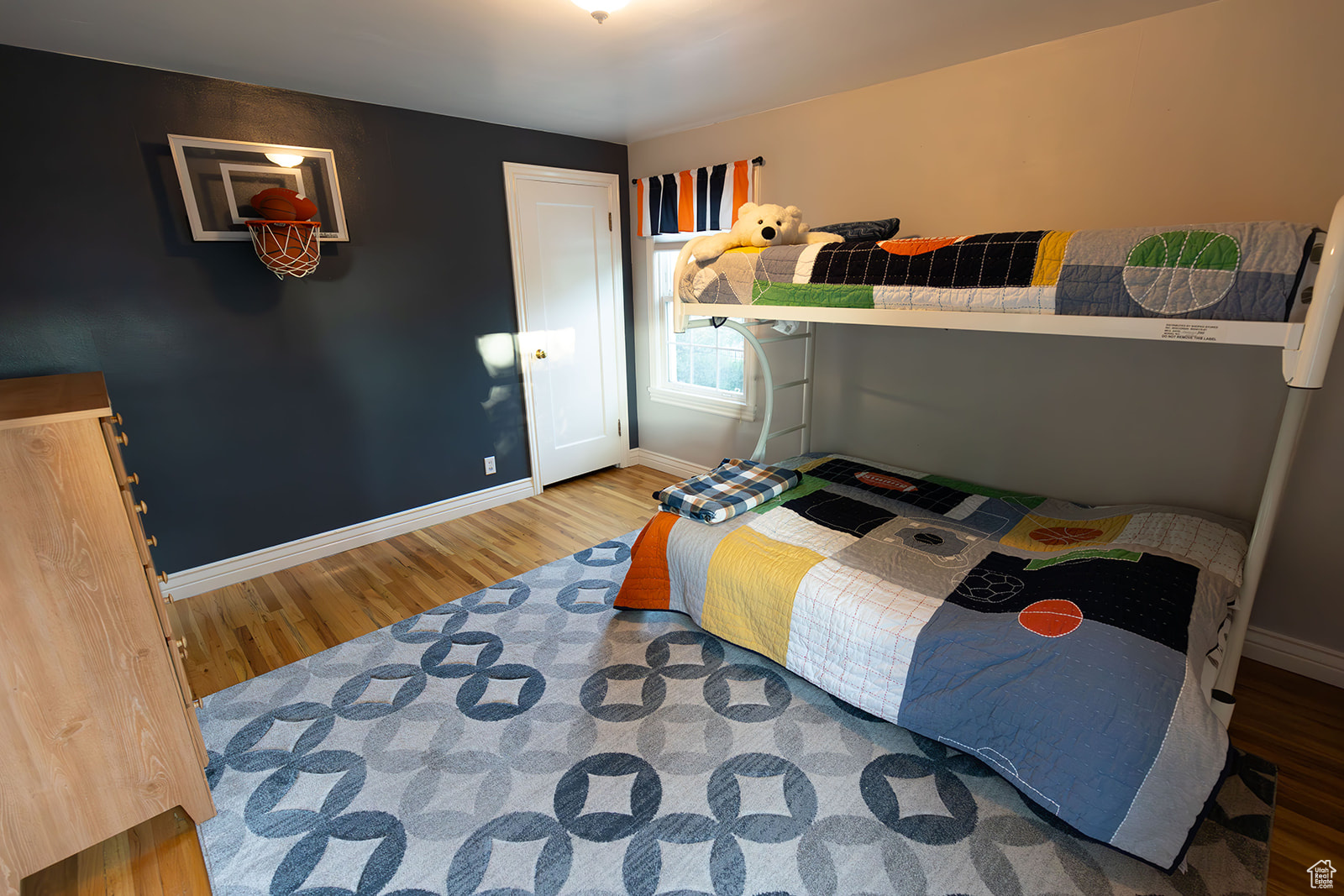 Bedroom with wood-type flooring