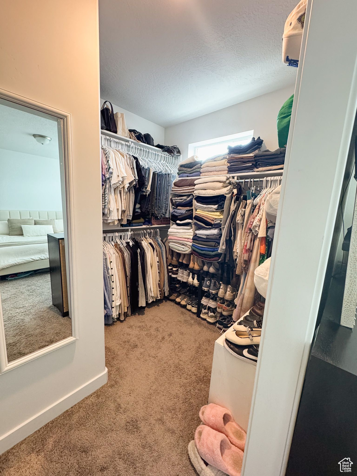 Spacious closet with carpet