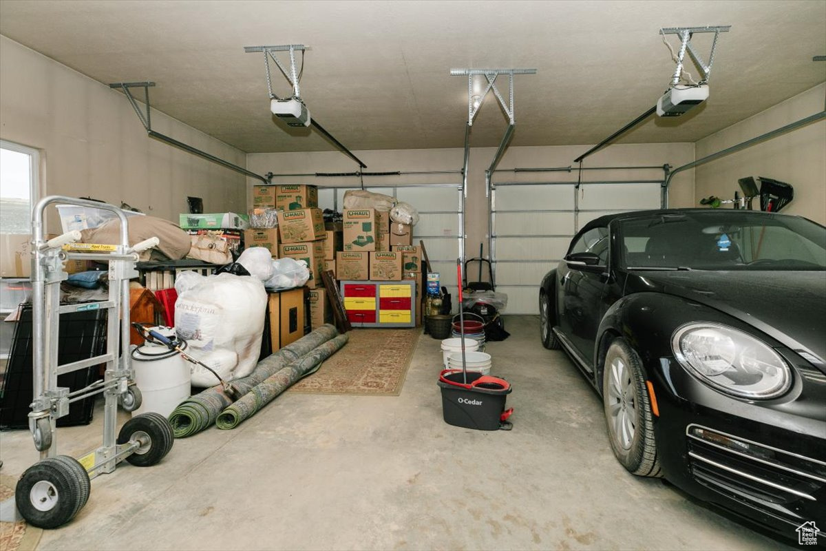 Garage featuring a garage door opener