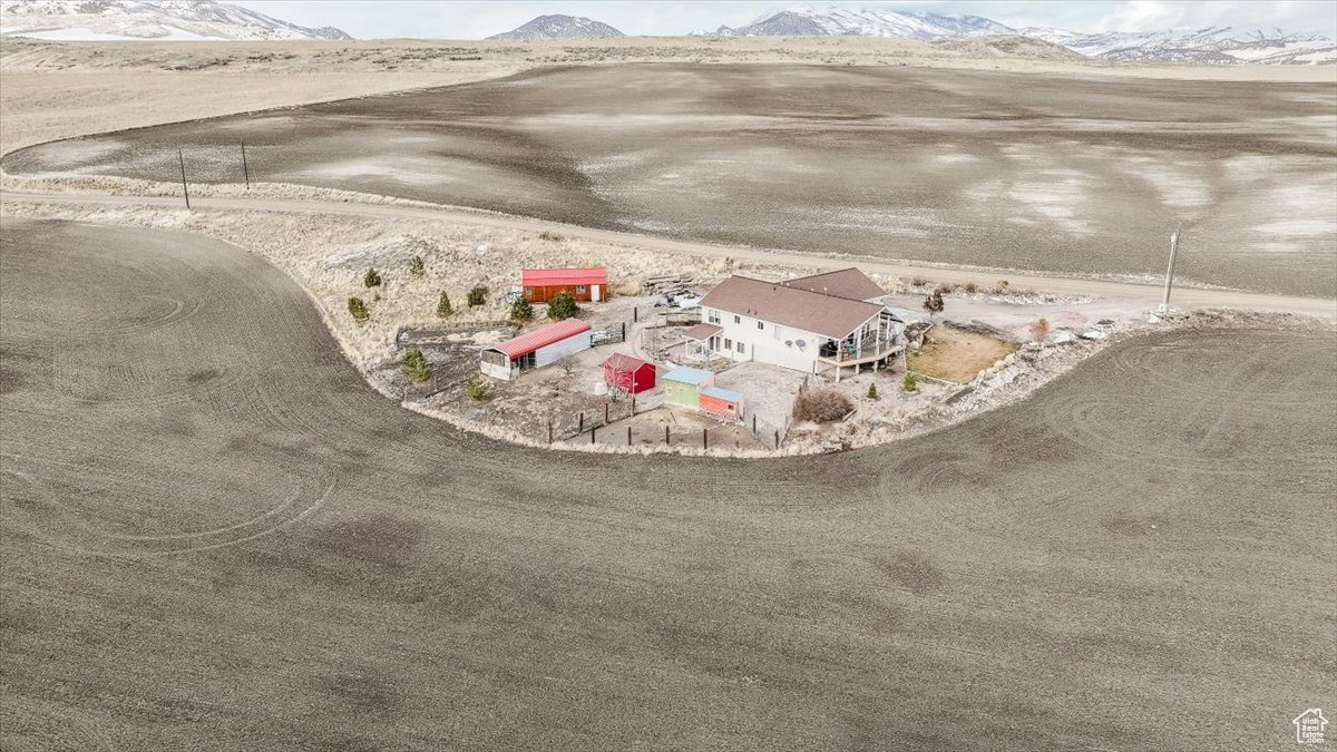 Birds eye view of property featuring a mountain view